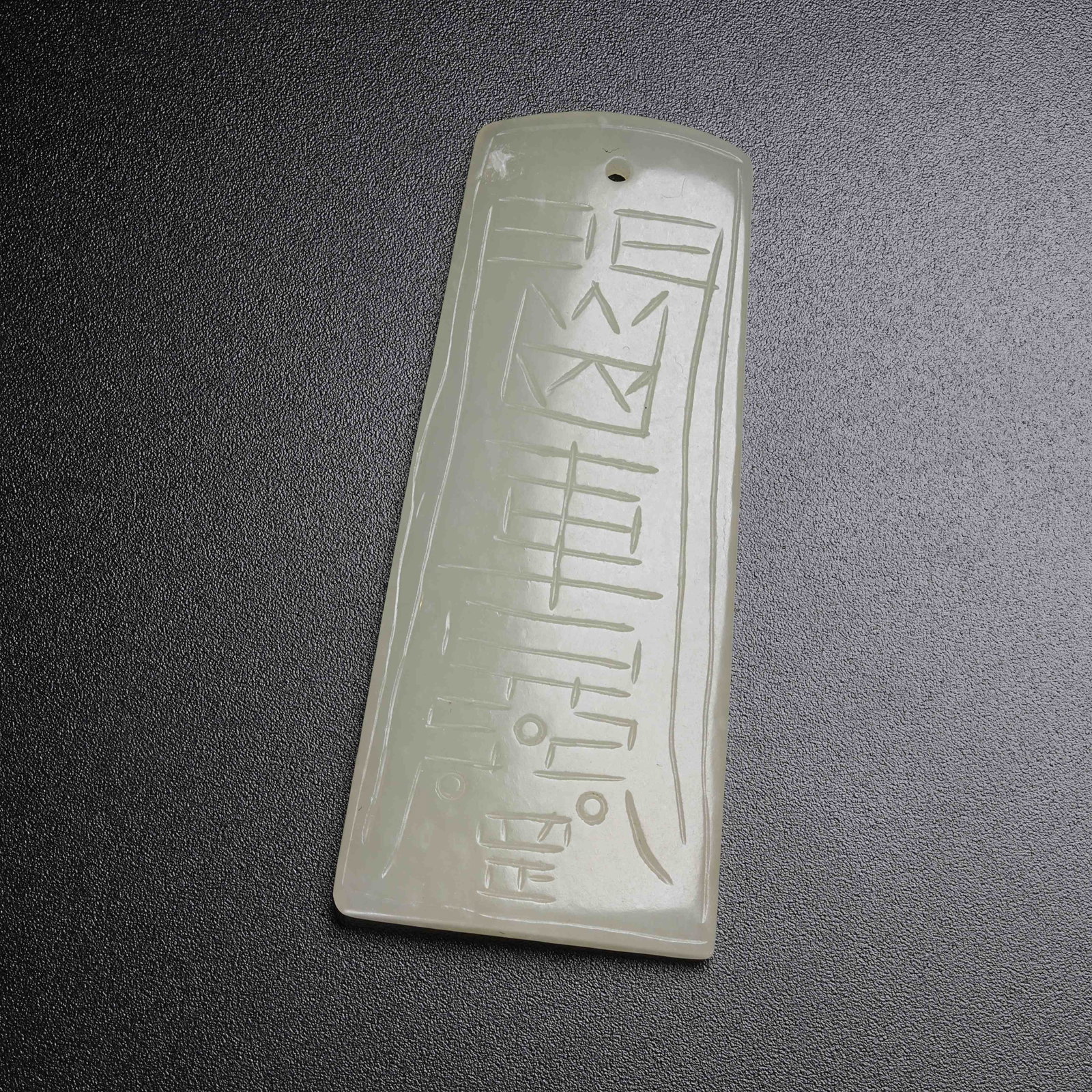 A HETIAN JADE PENDANT WITH EIGHT TRIGRAMS PATTERN: Hetian Jade Pendant with Eight Trigrams Pattern