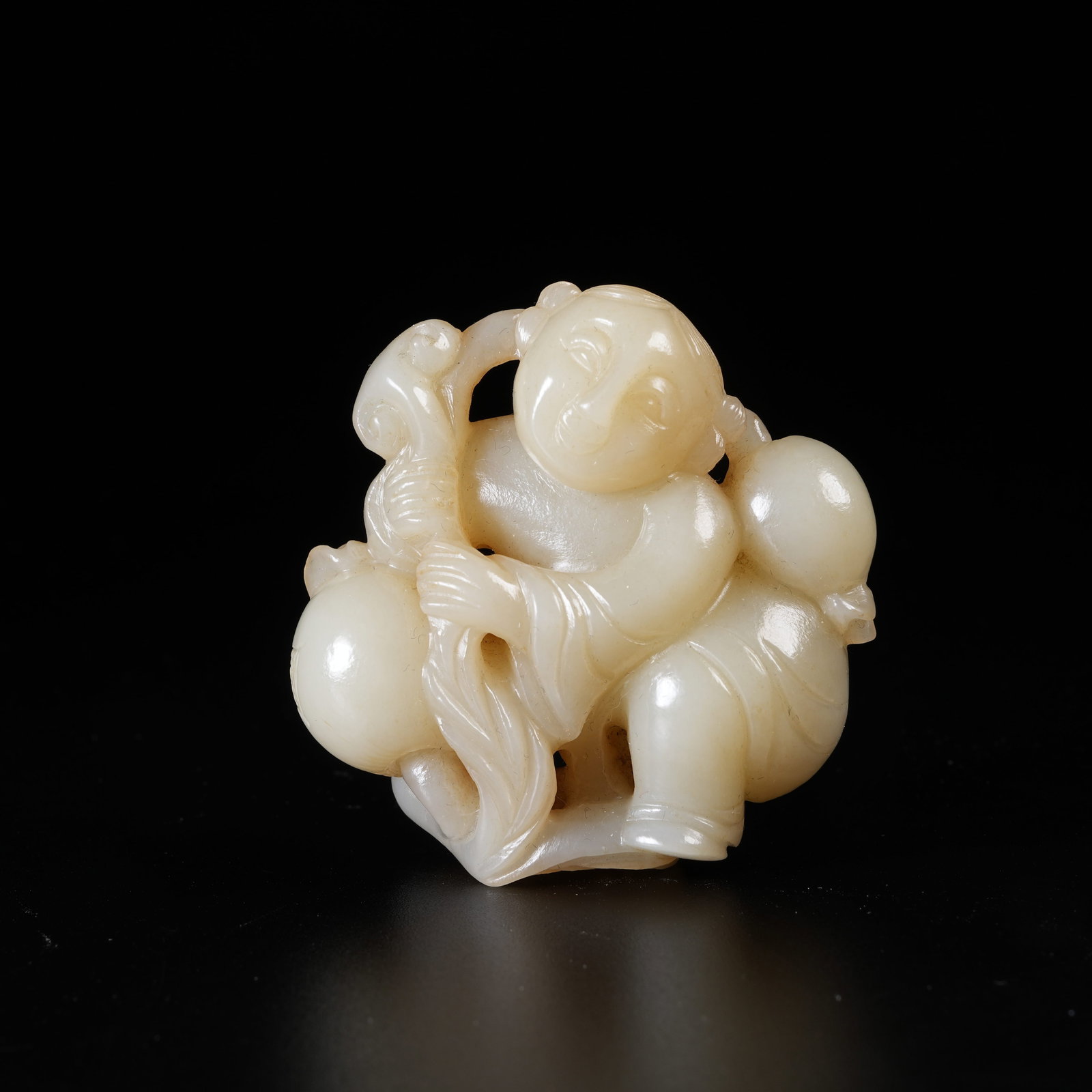 A HETIAN JADE PENDANT OF BOY PRESENTING LONGEVITY BLESSINGS: Hetian Jade Pendant of Boy Presenting Longevity Blessings