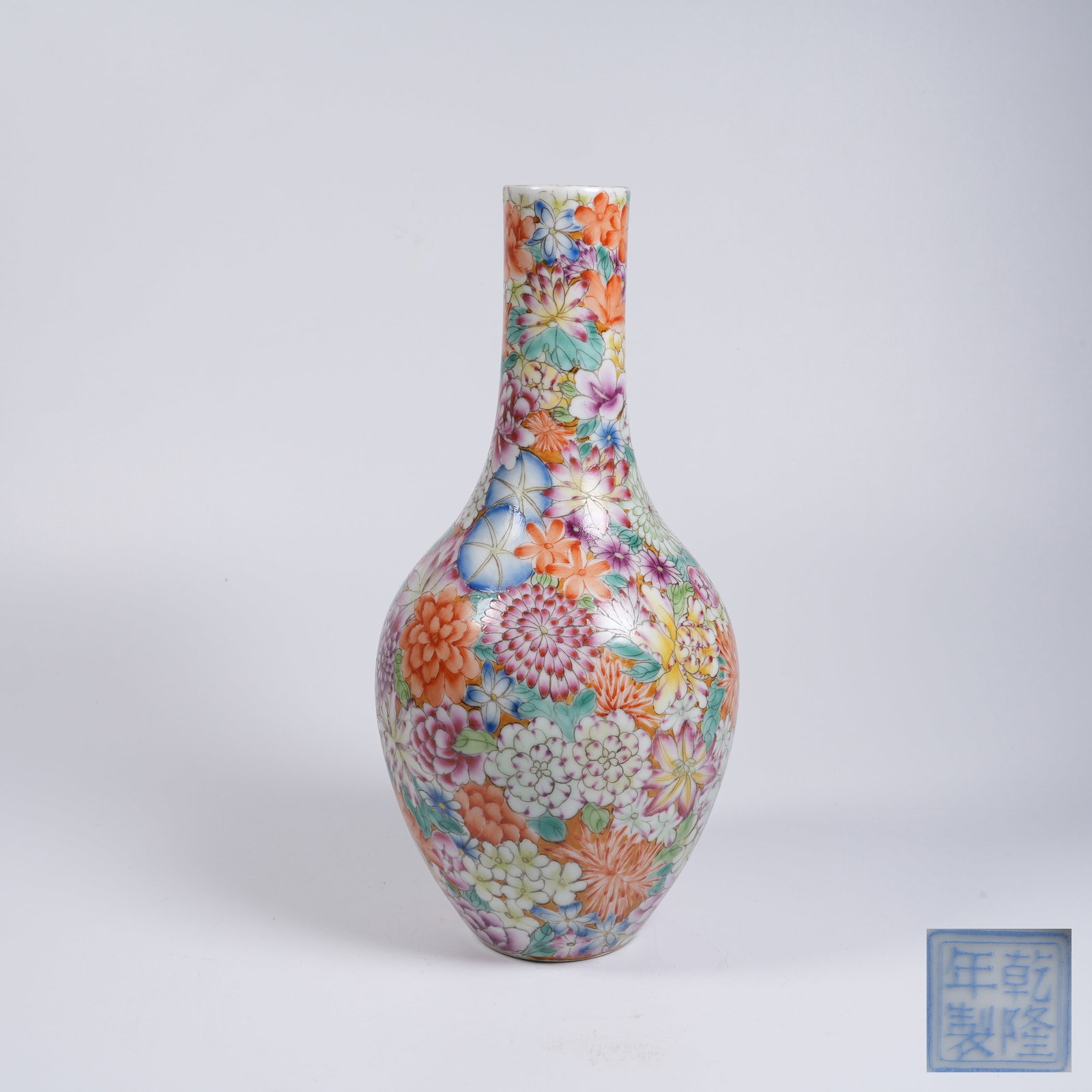 A FAMILLE-ROSE LONG-NECK VASE WITH ALL-OVER-FLORAL PATTERN: Famille-rose long-neck vase with all-over-floral pattern