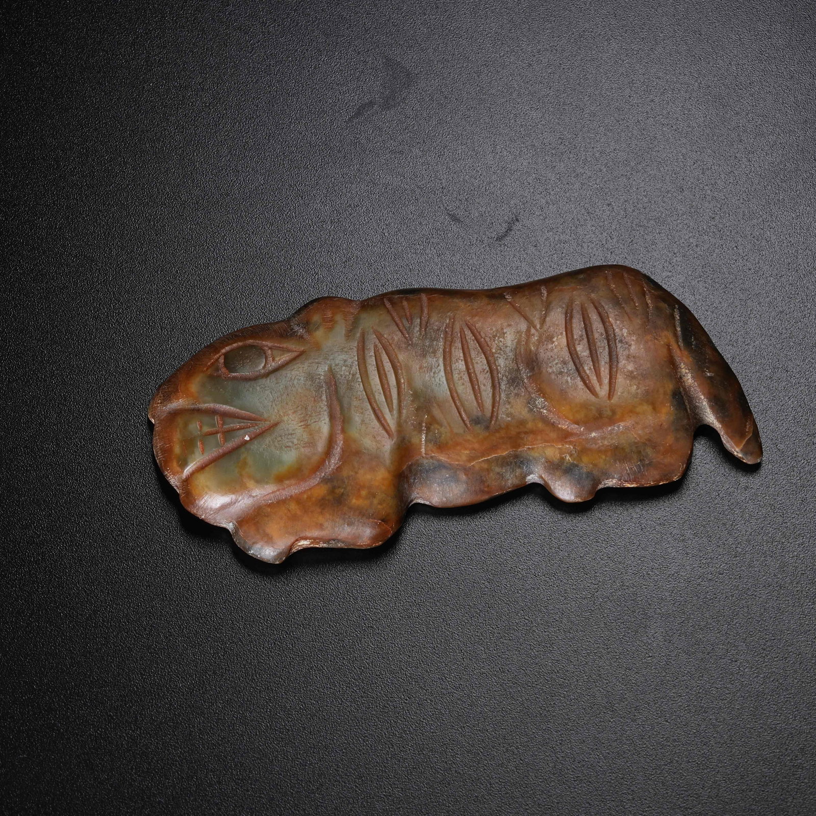 A ANCIENT JADE TIGER TALLY: Ancient Jade Tiger Tally