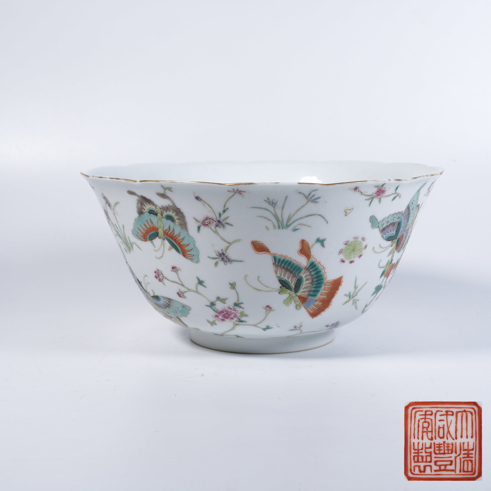 A FAMILLE-ROSE BOWL WITH FLOWER-AND-BUTTERFLY PATTERN: Famille-rose bowl with flower-and-butterfly pattern
