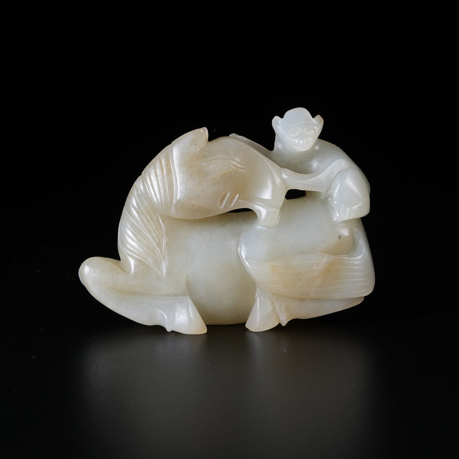 A HETIAN JADE ORNAMENT SYMBOLIZING OFFICIAL PROMOTION UPON HORSEBACK: Hetian Jade Ornament Symbolizing Official Promotion Upon Horseback