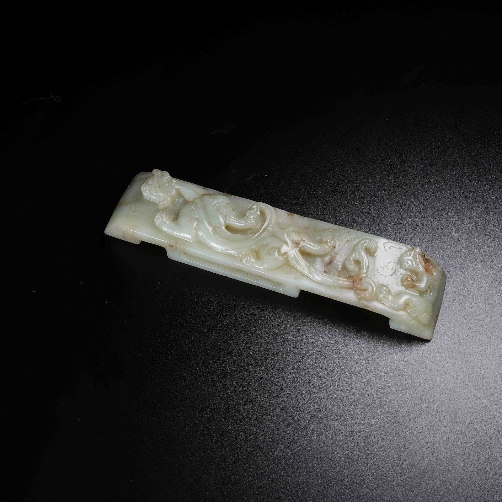 A HETIAN JADE SWORD GUARD WITH CHI DRAGON PATTERN (1 of 9)