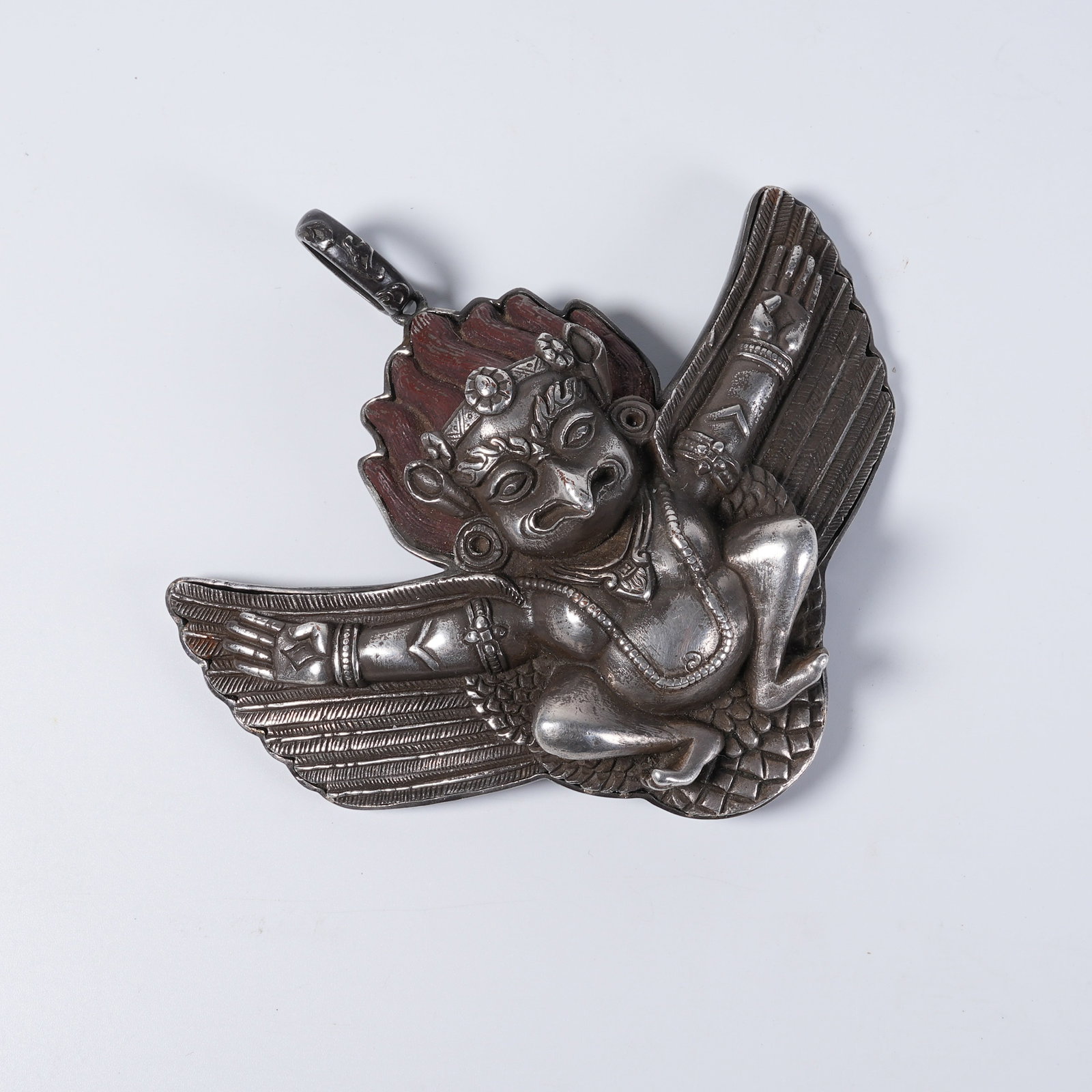 A IRON-CORED SILVER PENDANT OF GREAT ROC BIRD (1 of 10)