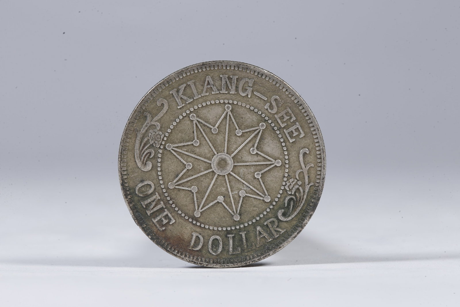 A SILVER DOLLAR COIN - 3