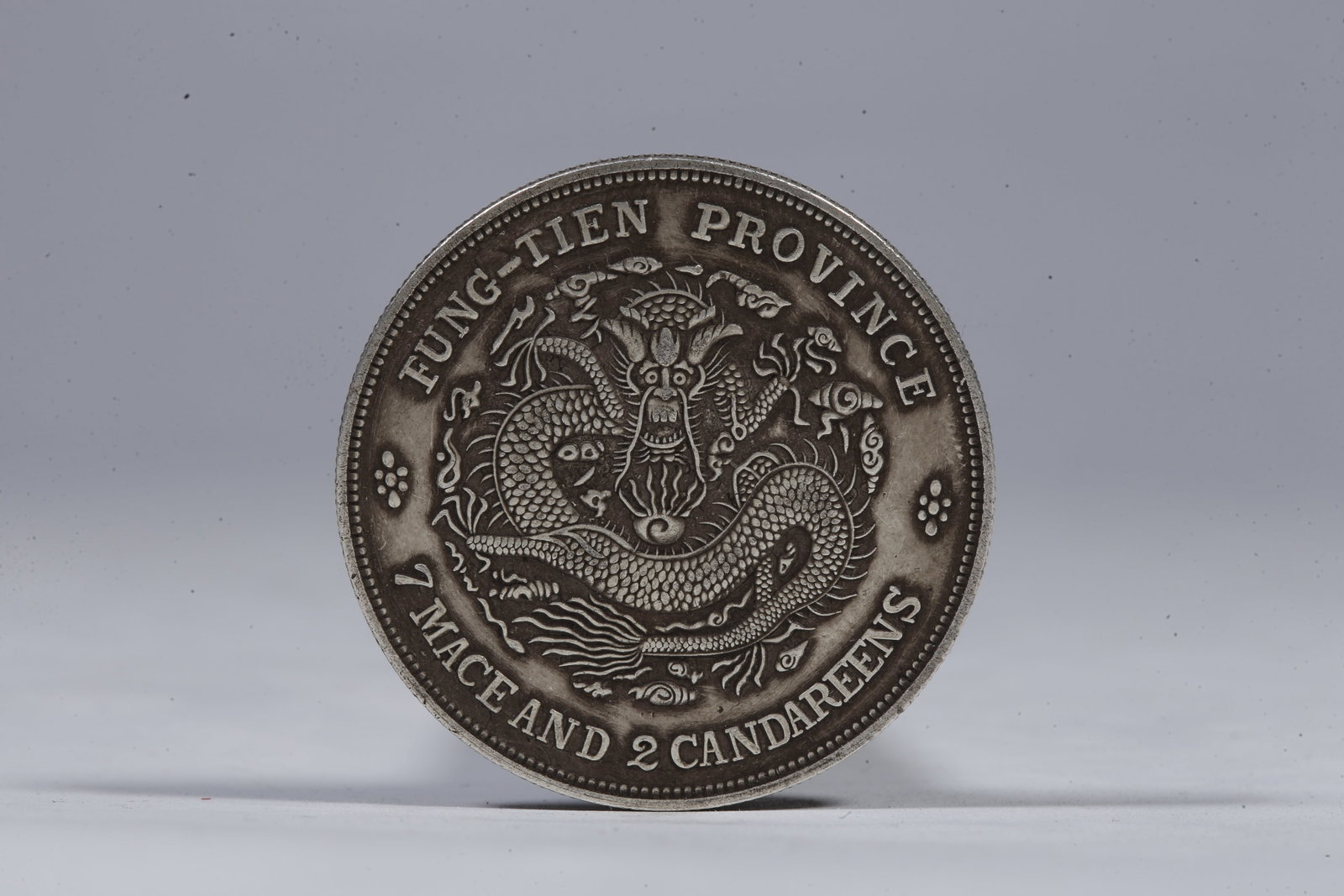A SILVER DOLLAR COIN - 3
