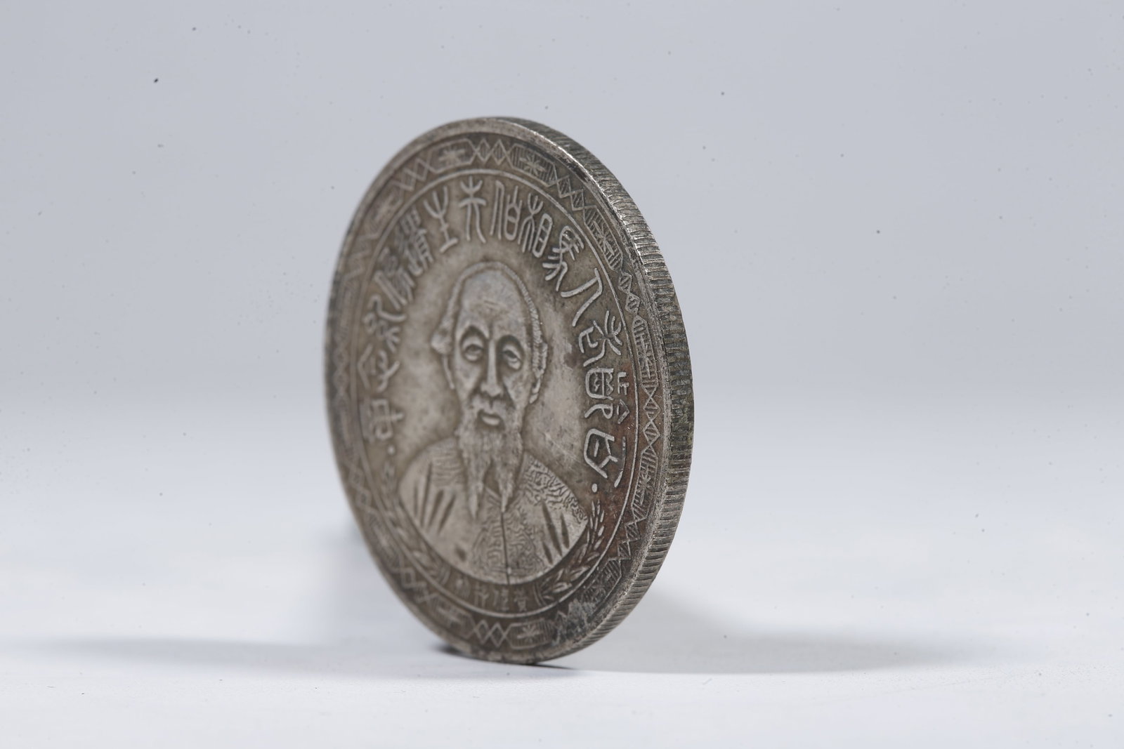 A SILVER DOLLAR COIN - 2