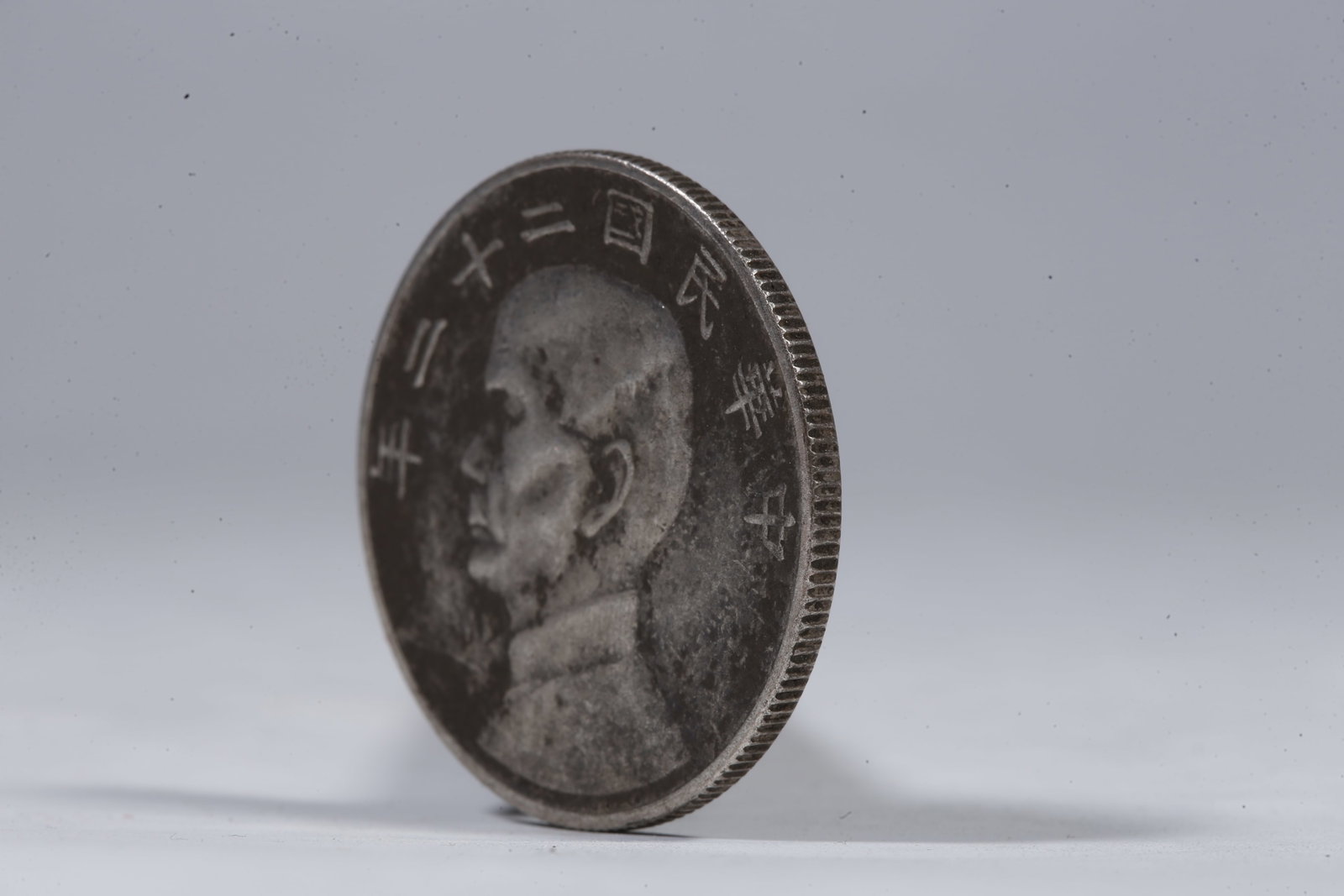 A SILVER DOLLAR COIN - 2