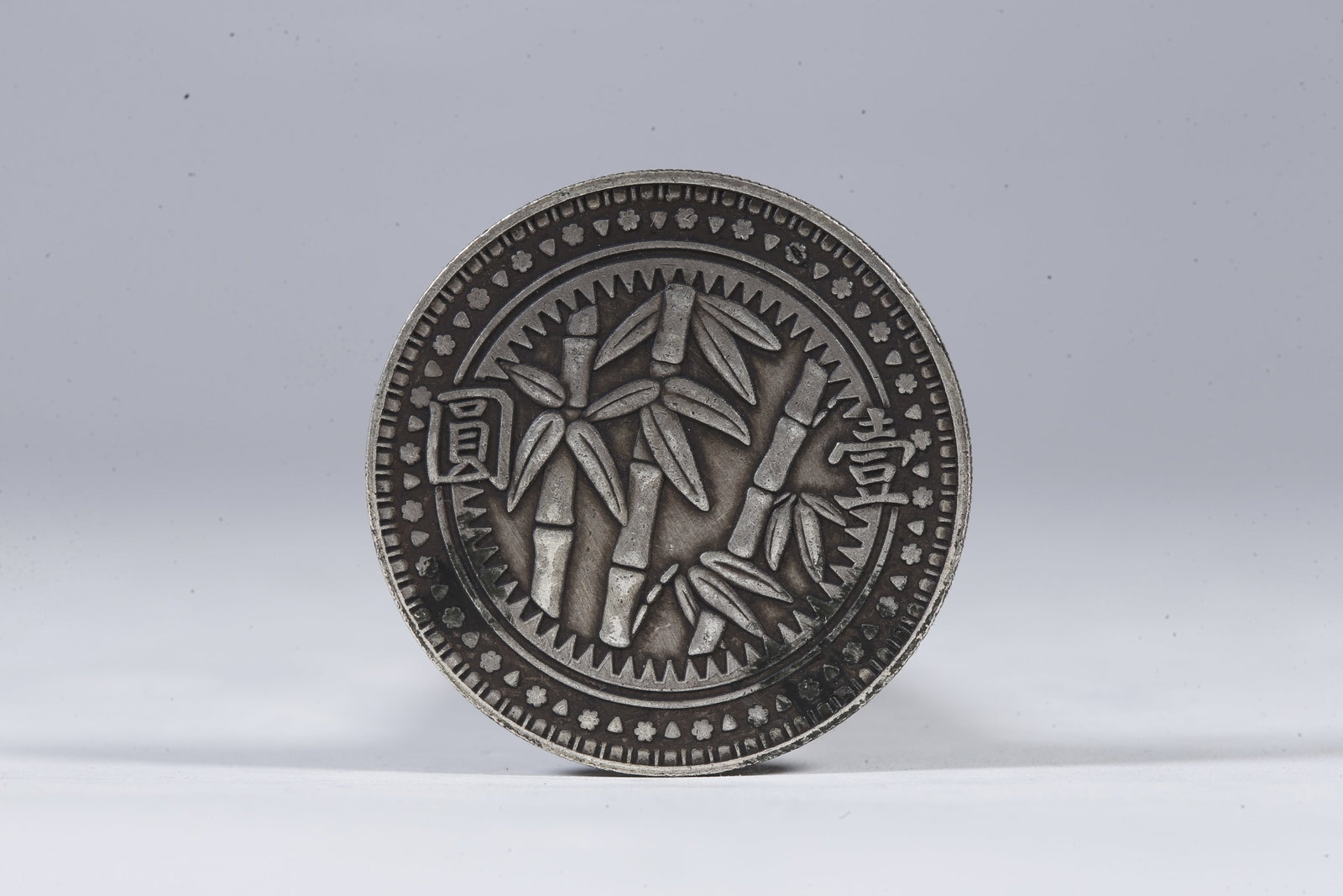 A SILVER DOLLAR COIN - 3