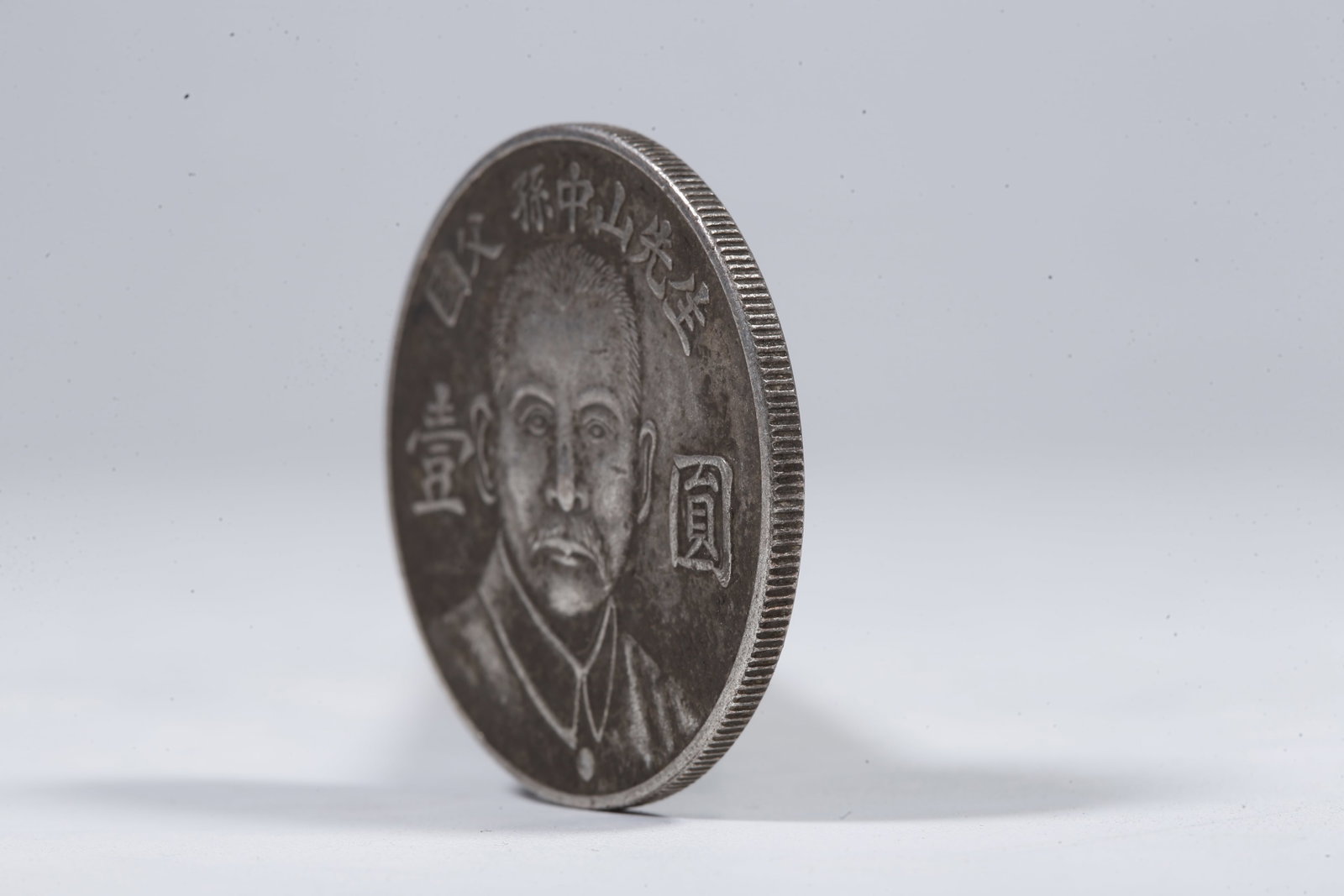 A SILVER DOLLAR COIN - 2