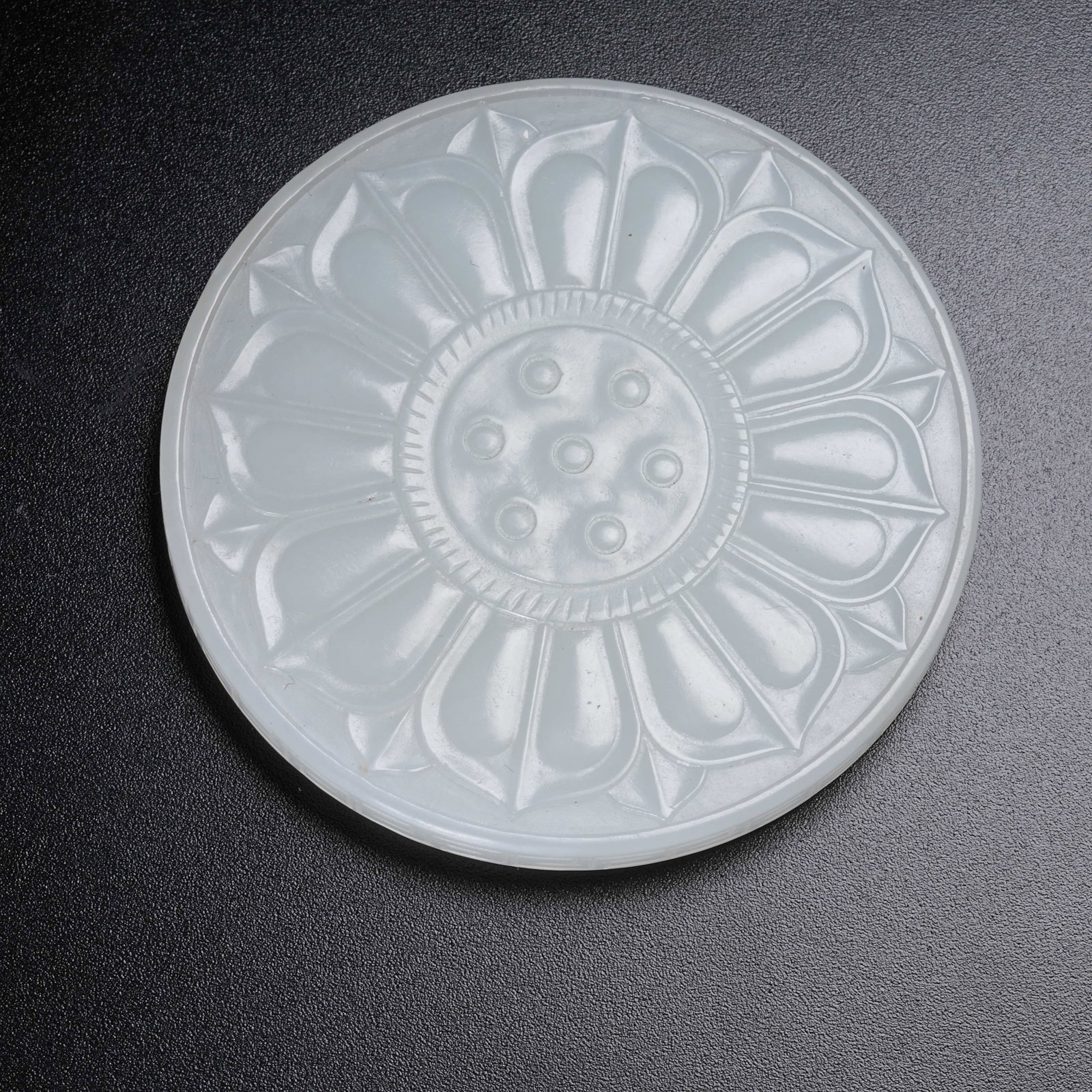A HETIAN JADE BI DISC WITH LOTUS PETAL PATTERN: Hetian Jade Bi Disc with Lotus Petal Pattern