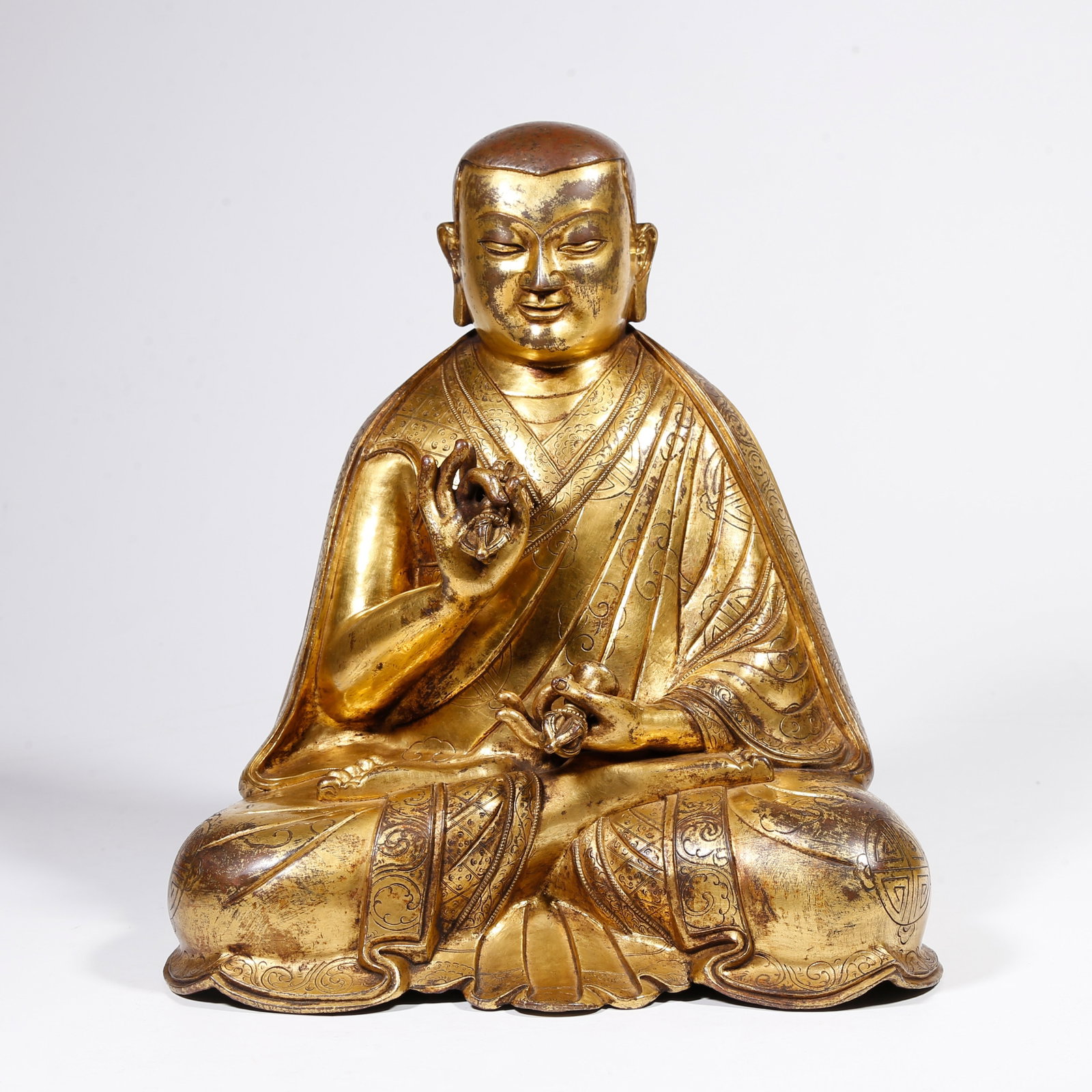 A GILT-BRONZE LAMA MASTER STATUE: Gilt-bronze Lama master statue