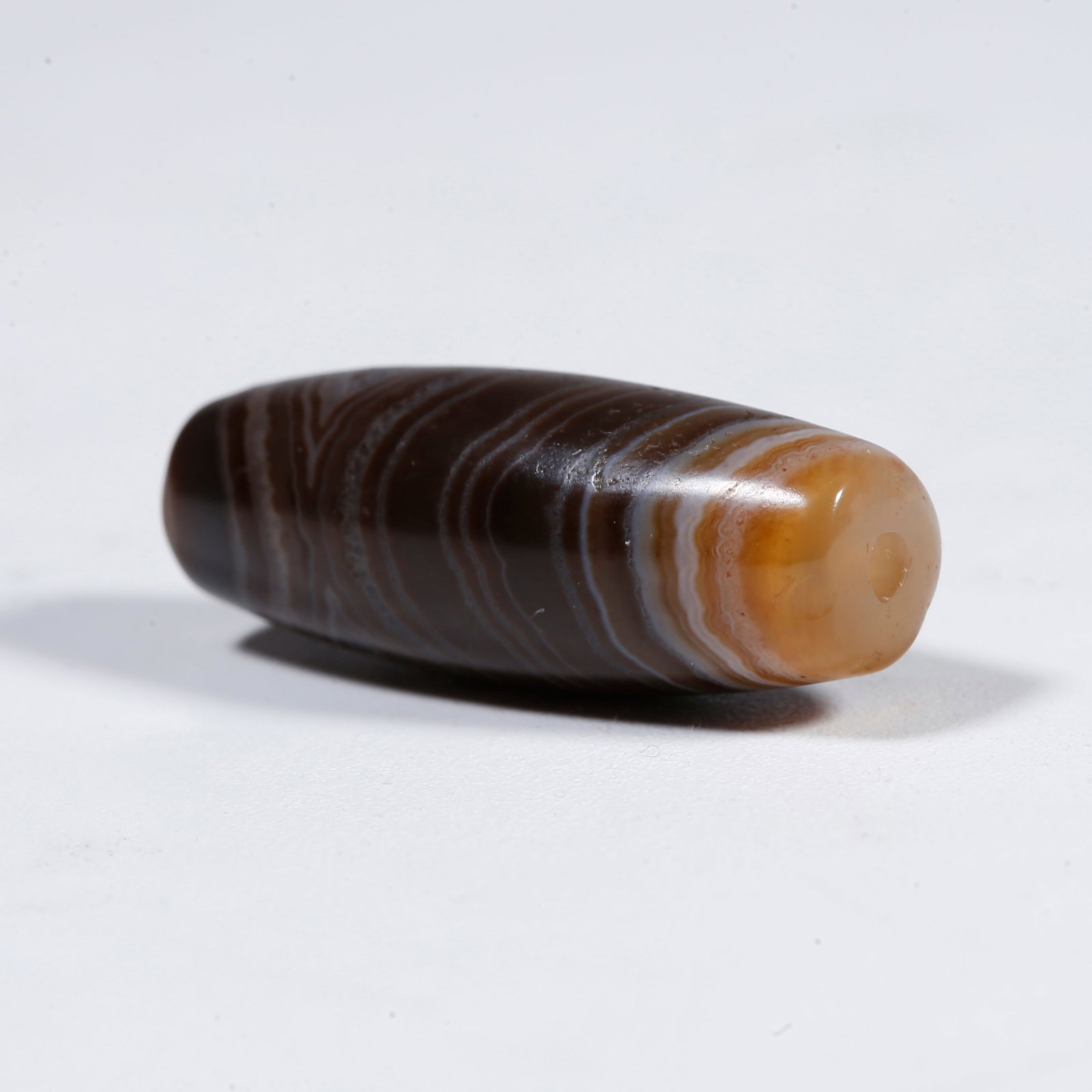 A SILK-BANDED AGATE DZI BEAD (1 of 9)