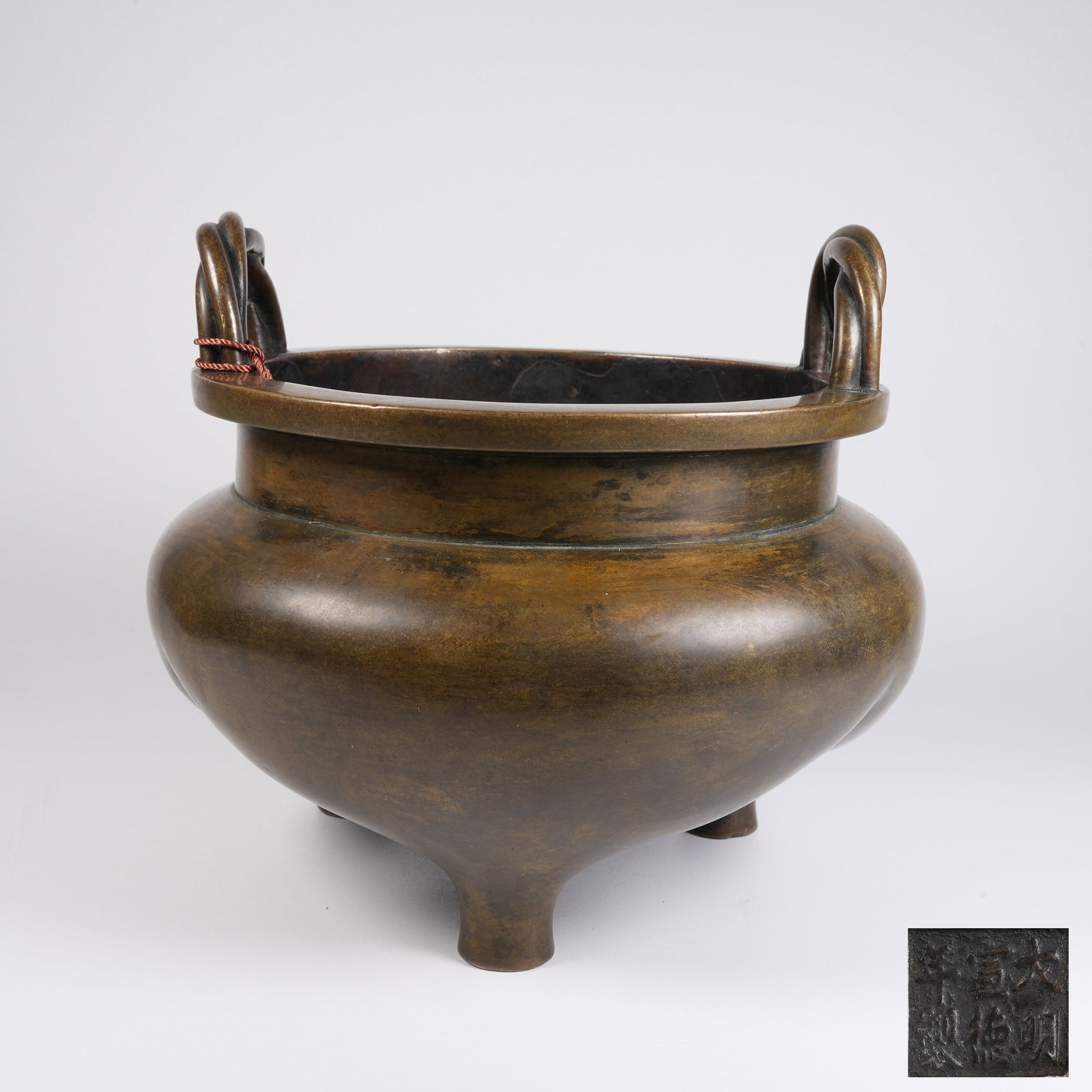 A BRONZE CENSER WITH CABLE-TWISTED EARS: Bronze Censer with Cable-twisted Ears
