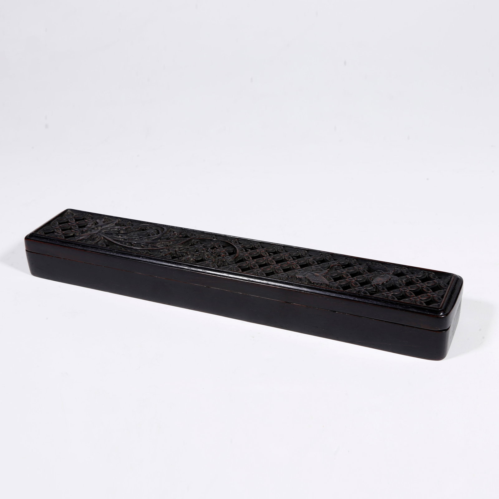 A ZITAN-WOOD CARVED OPENWORK FLOWER-PATTERN COVERED BOX: Zitan-wood carved openwork flower-pattern covered box