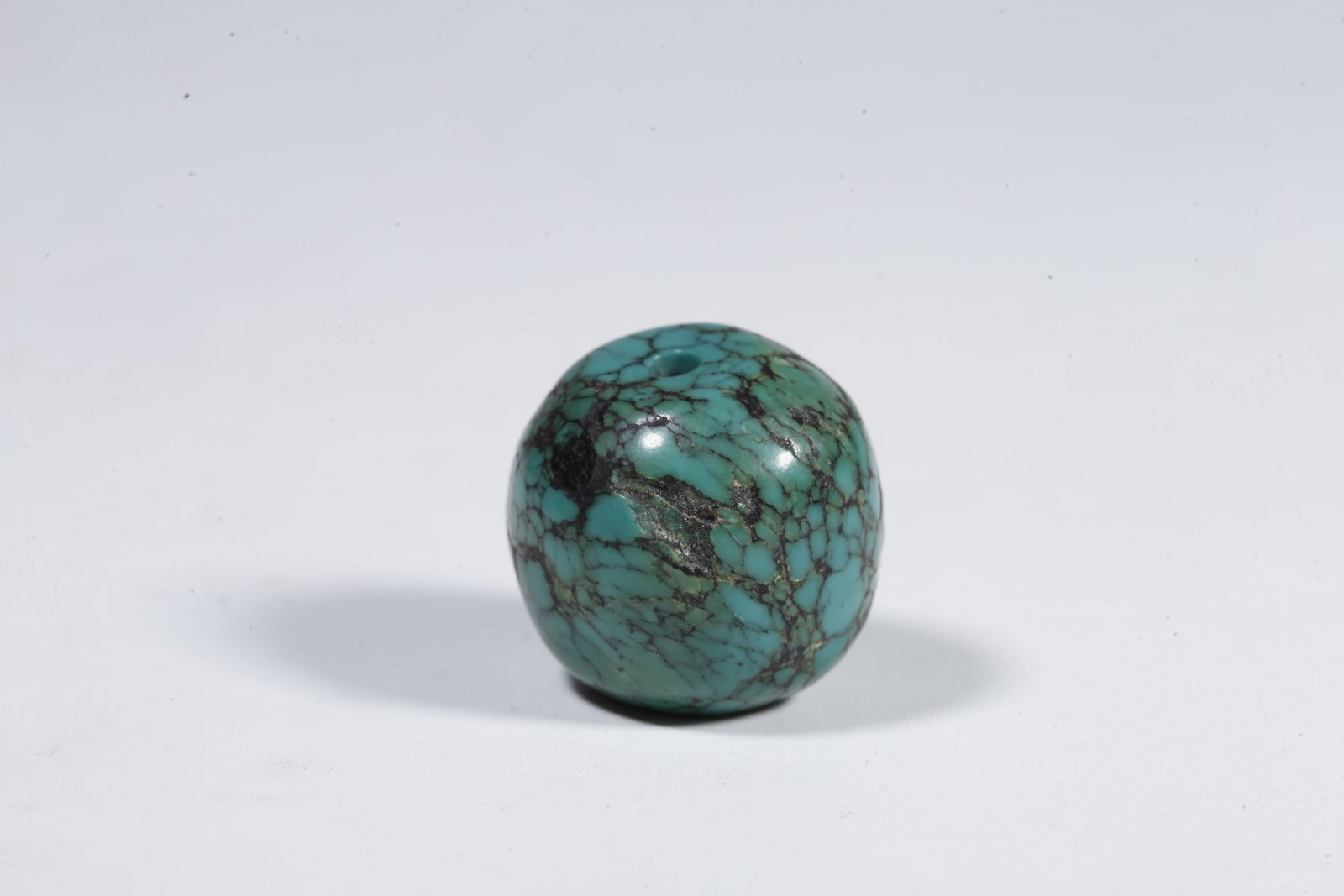 A TURQUOISE BEAD (PAIR) - 2