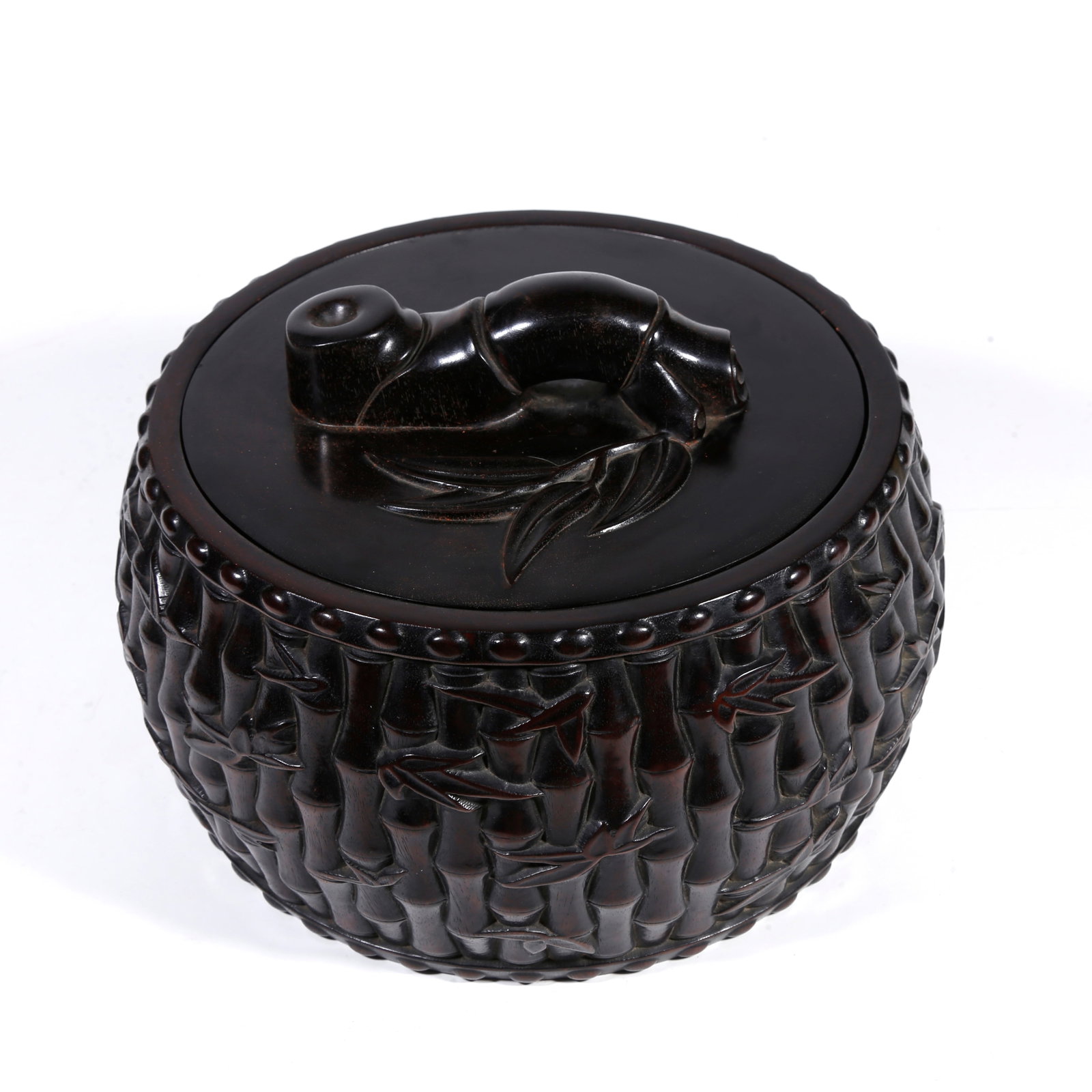A ZITAN-WOOD CARVED BAMBOO-KNOB COVERED JAR: Zitan-wood carved bamboo-knob covered jar