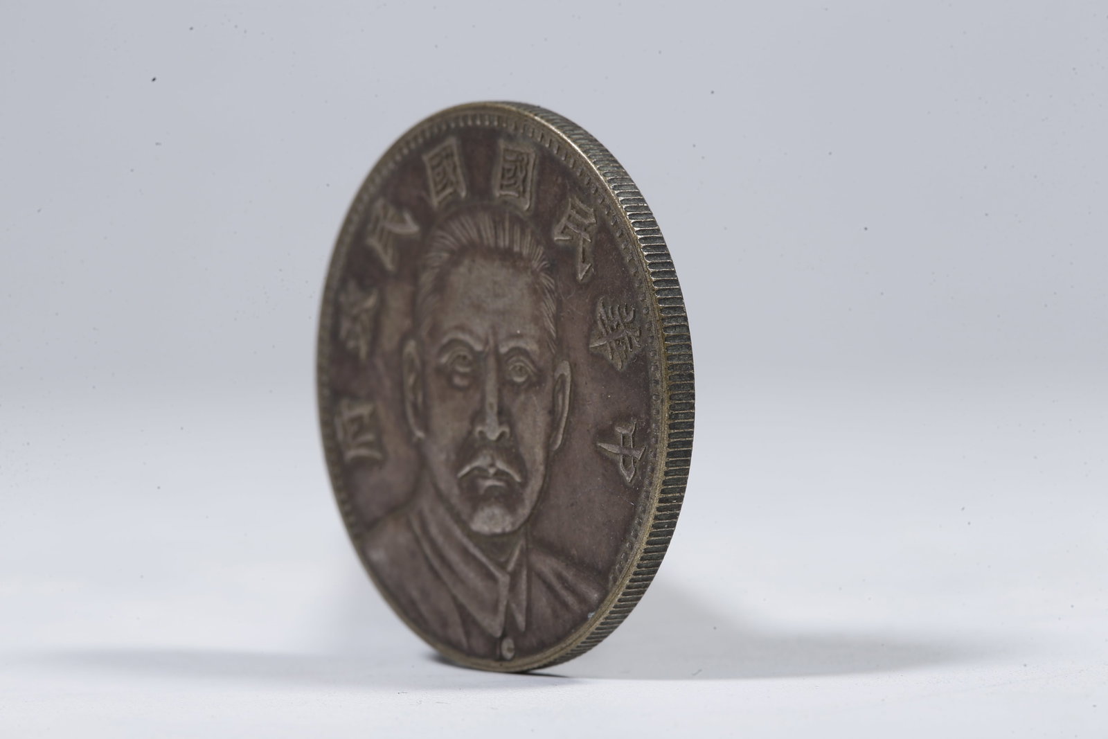 A SILVER DOLLAR COIN - 2