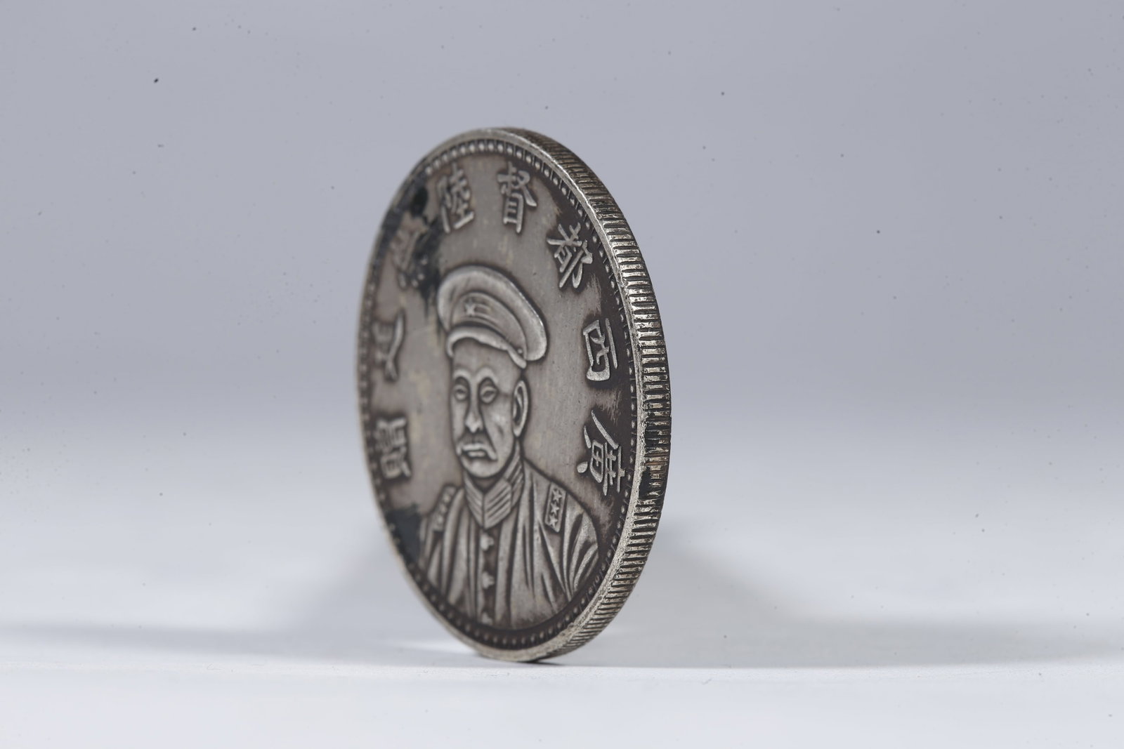A SILVER DOLLAR COIN - 2