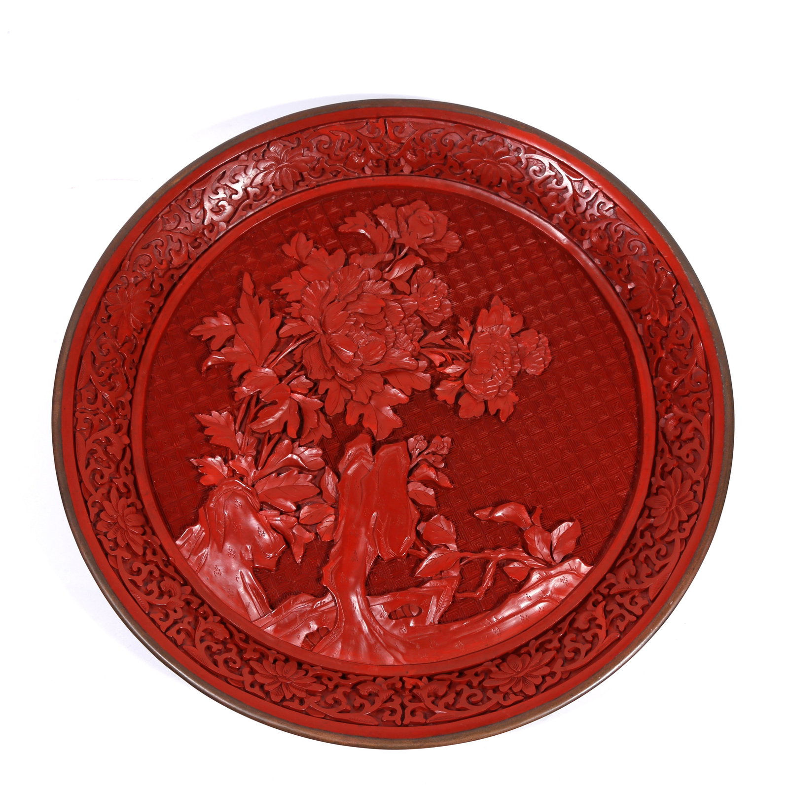 A CARVED-RED PLATE WITH ROCK-AND-FLOWER PATTERN (1 of 9)