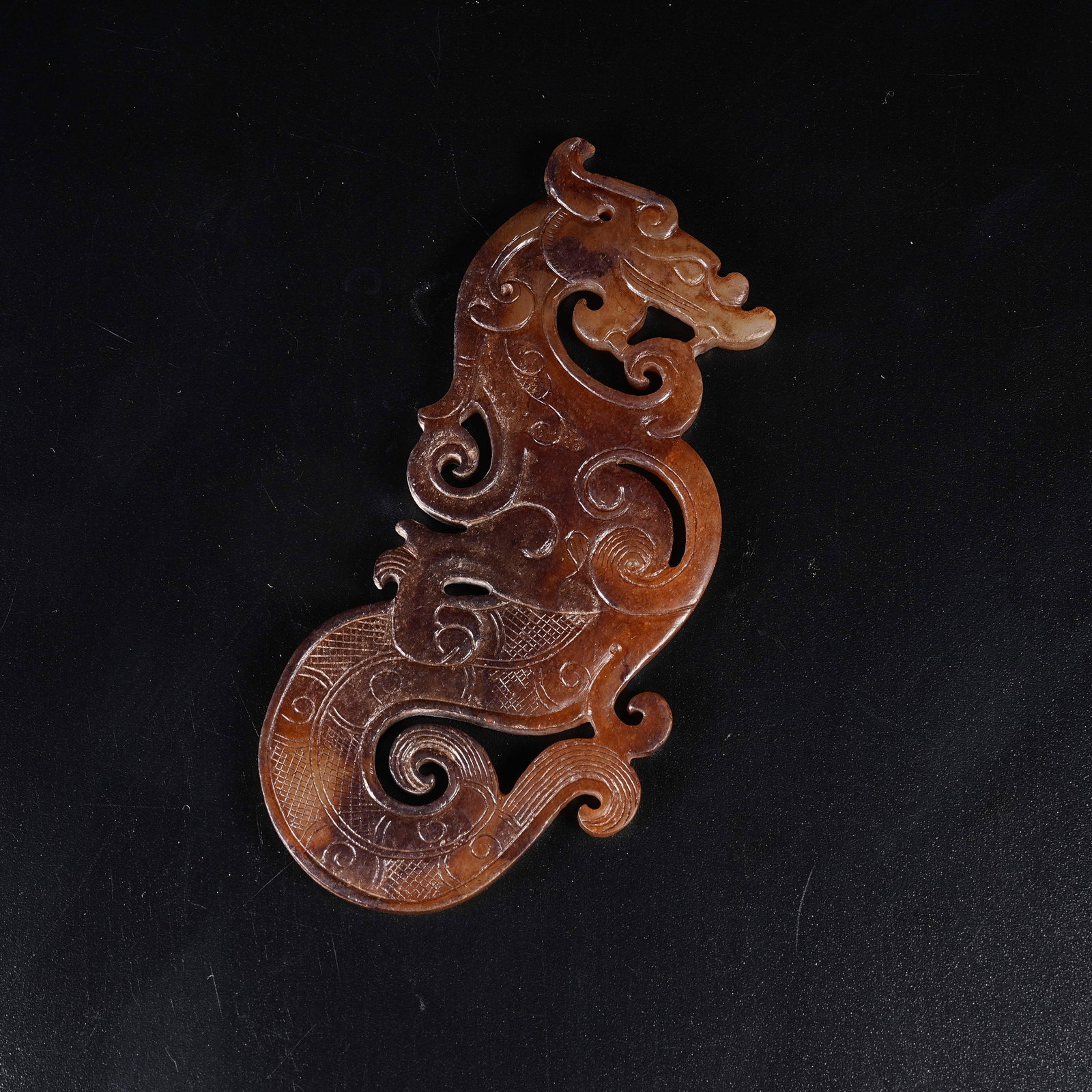 A ARCHAIC JADE S-SHAPED DRAGON PENDANT: Archaic Jade S-shaped Dragon Pendant