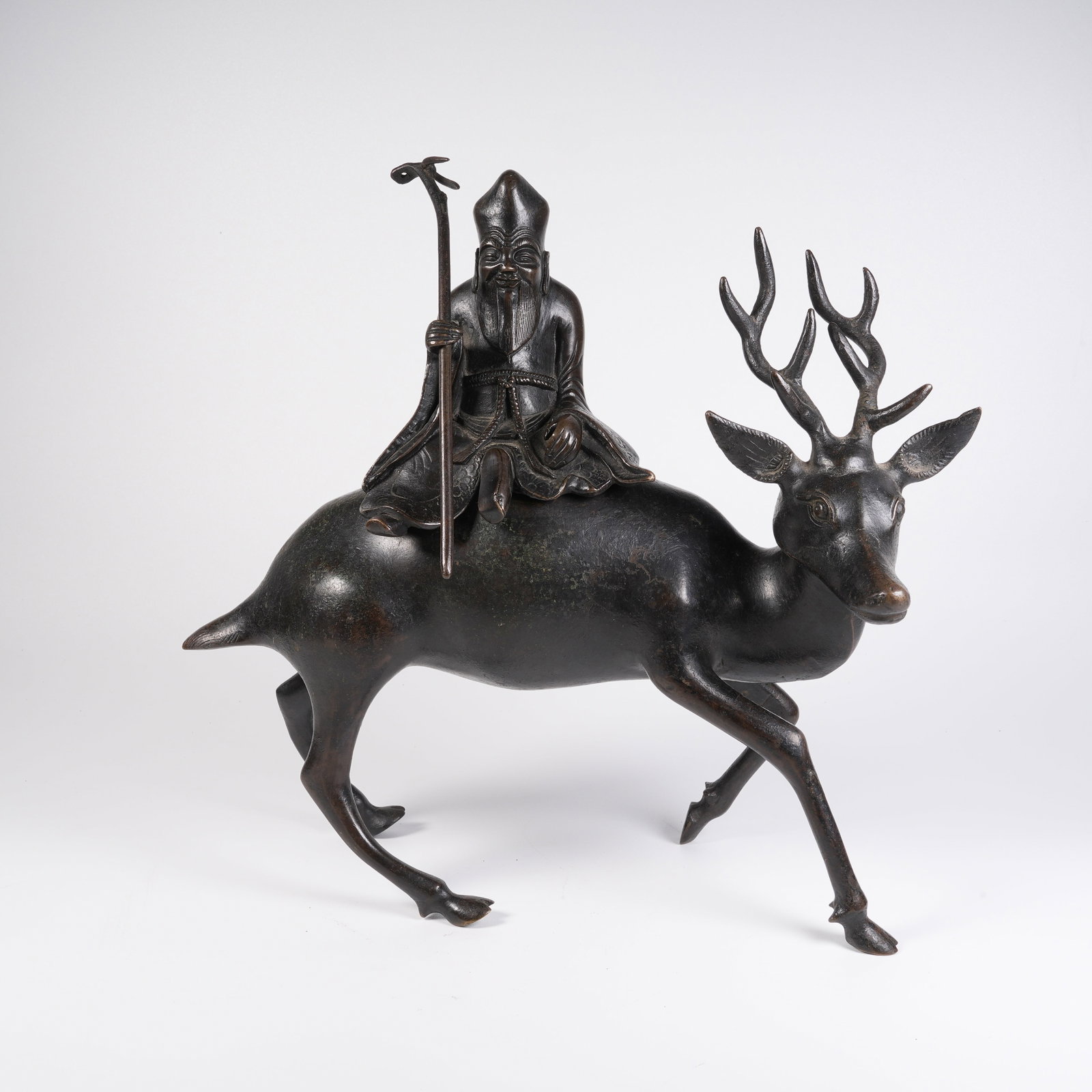 A BRONZE GOD-OF-LONGEVITY-SHAPED CENSER (1 of 9)