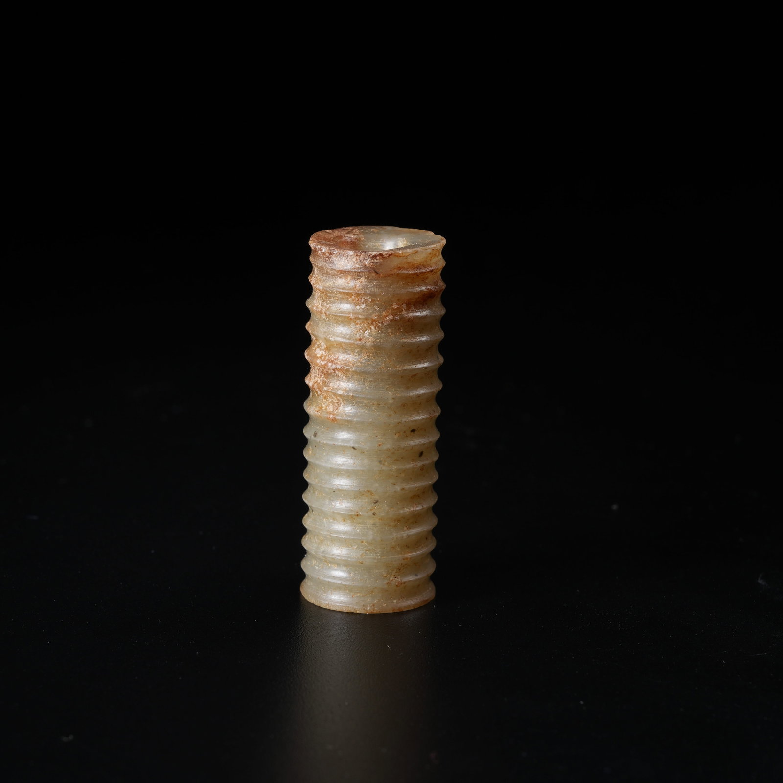 A ANCIENT JADE TUBE PENDANT WITH STRING LINE PATTERN: Ancient Jade Tube Pendant with String Line Pattern