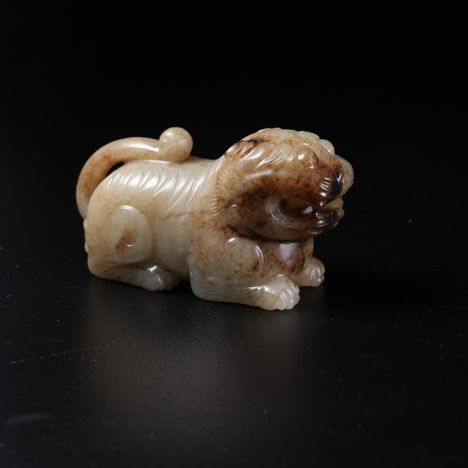 A HETIAN JADE AUSPICIOUS BEAST ORNAMENT: Hetian Jade Auspicious Beast Ornament