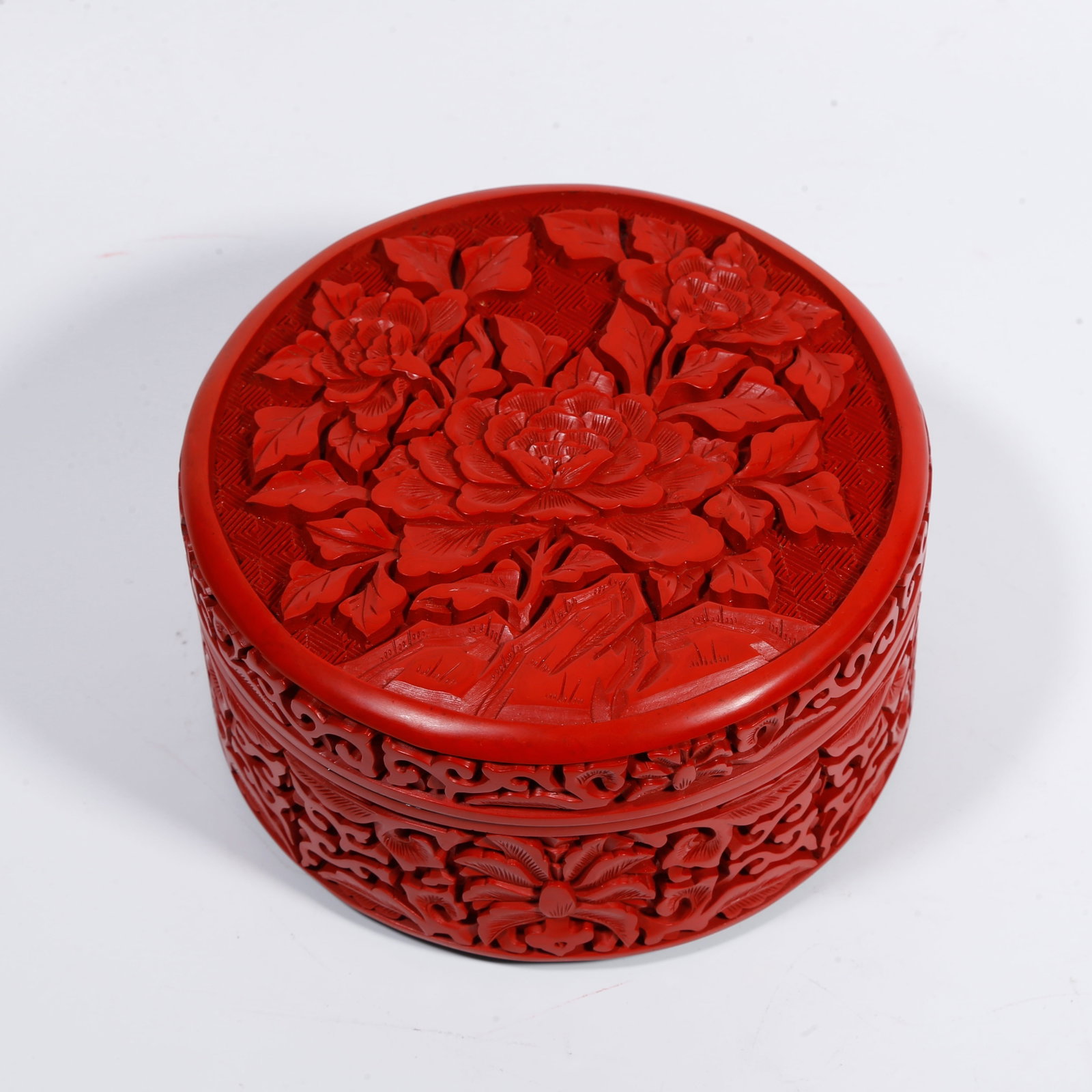 A CARVED-RED COVERED BOX WITH ROCK-AND-FLOWER PATTERN (1 of 9)