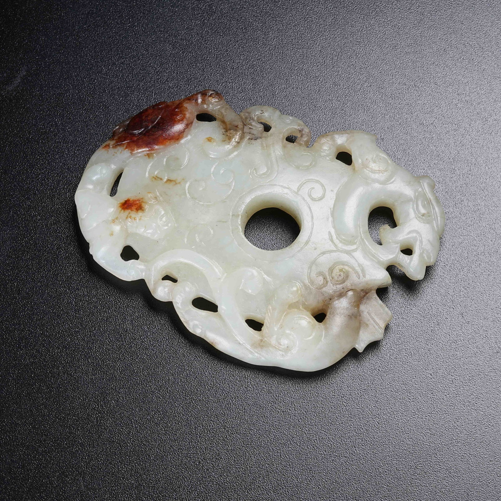 A ANCIENT JADE HEART-SHAPED PENDANT WITH CHI DRAGON PATTERN (1 of 9)