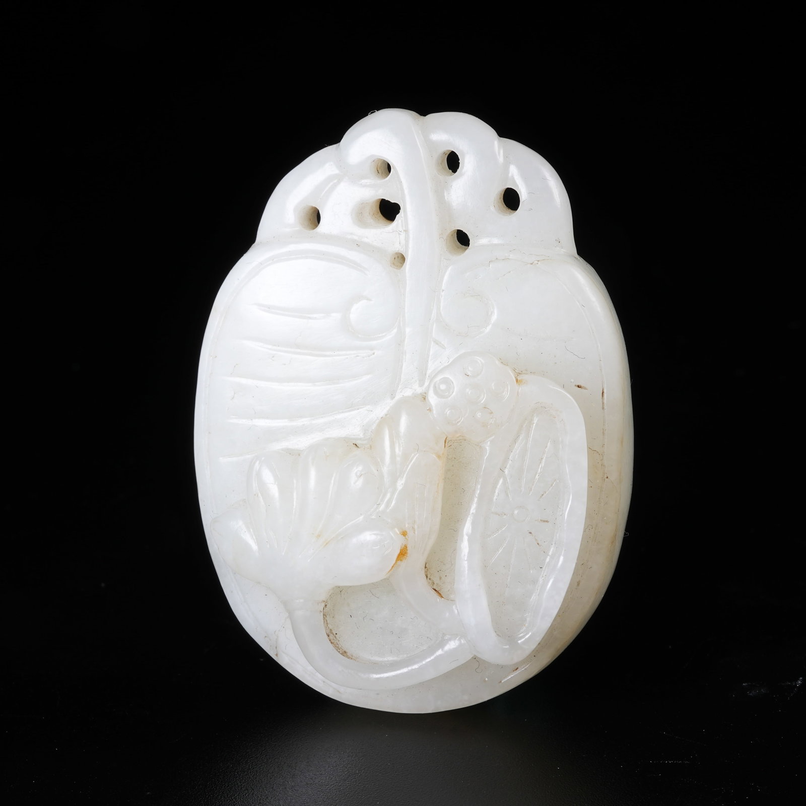 A HETIAN JADE LOTUS LEAF PENDANT: Hetian Jade Lotus Leaf Pendant