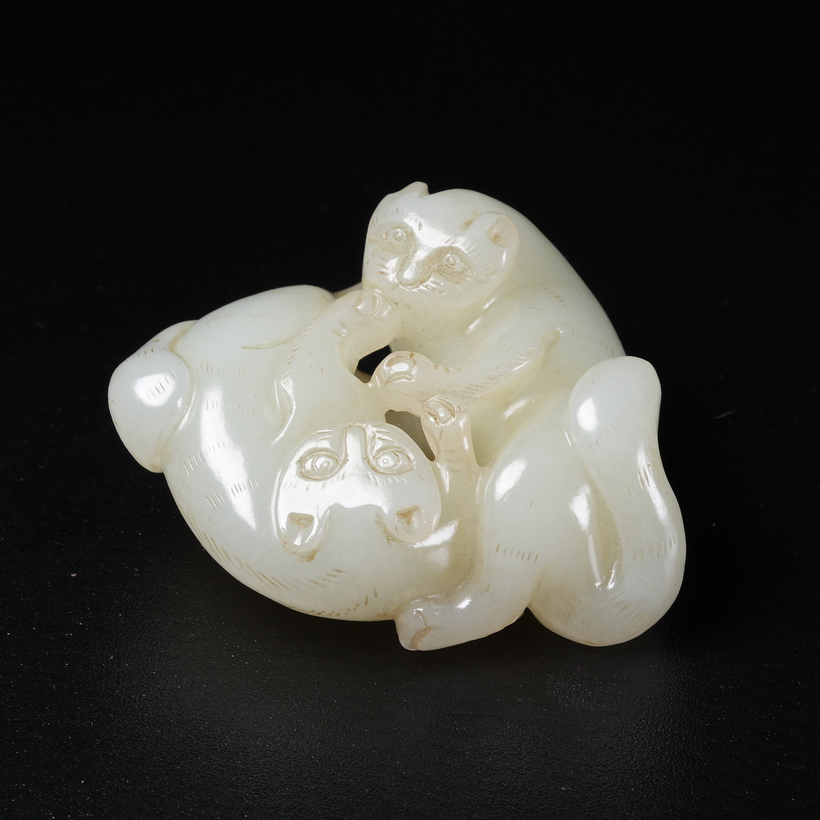 A ORNAMENT OF AUSPICIOUS BEAST IN HETIAN JADE: Ornament of auspicious beast in Hetian jade