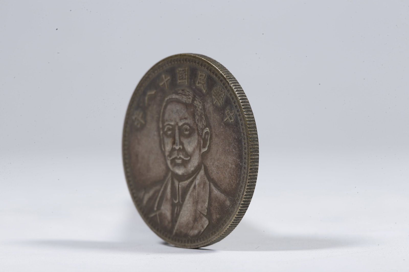 A SILVER DOLLAR COIN - 2