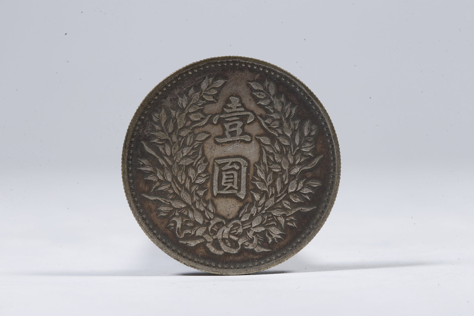 A SILVER DOLLAR COIN - 3