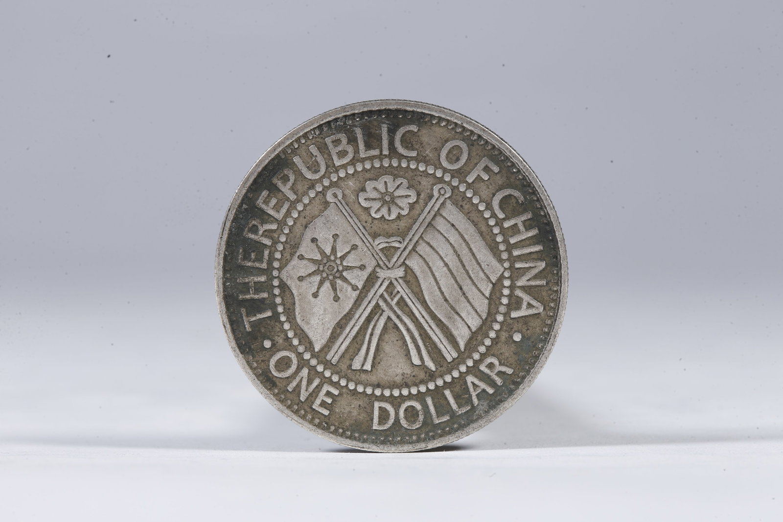 A SILVER DOLLAR COIN - 3