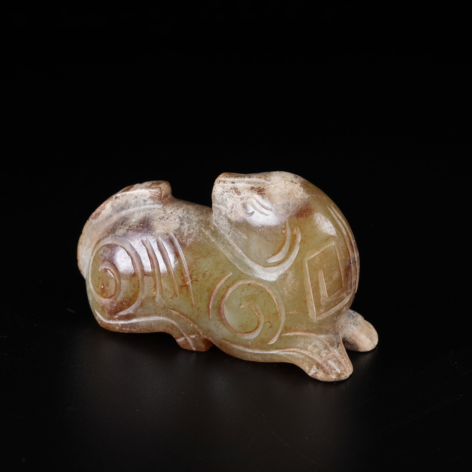A ARCHAIC JADE RECUMBENT BEAST ORNAMENT: Archaic Jade Recumbent Beast Ornament