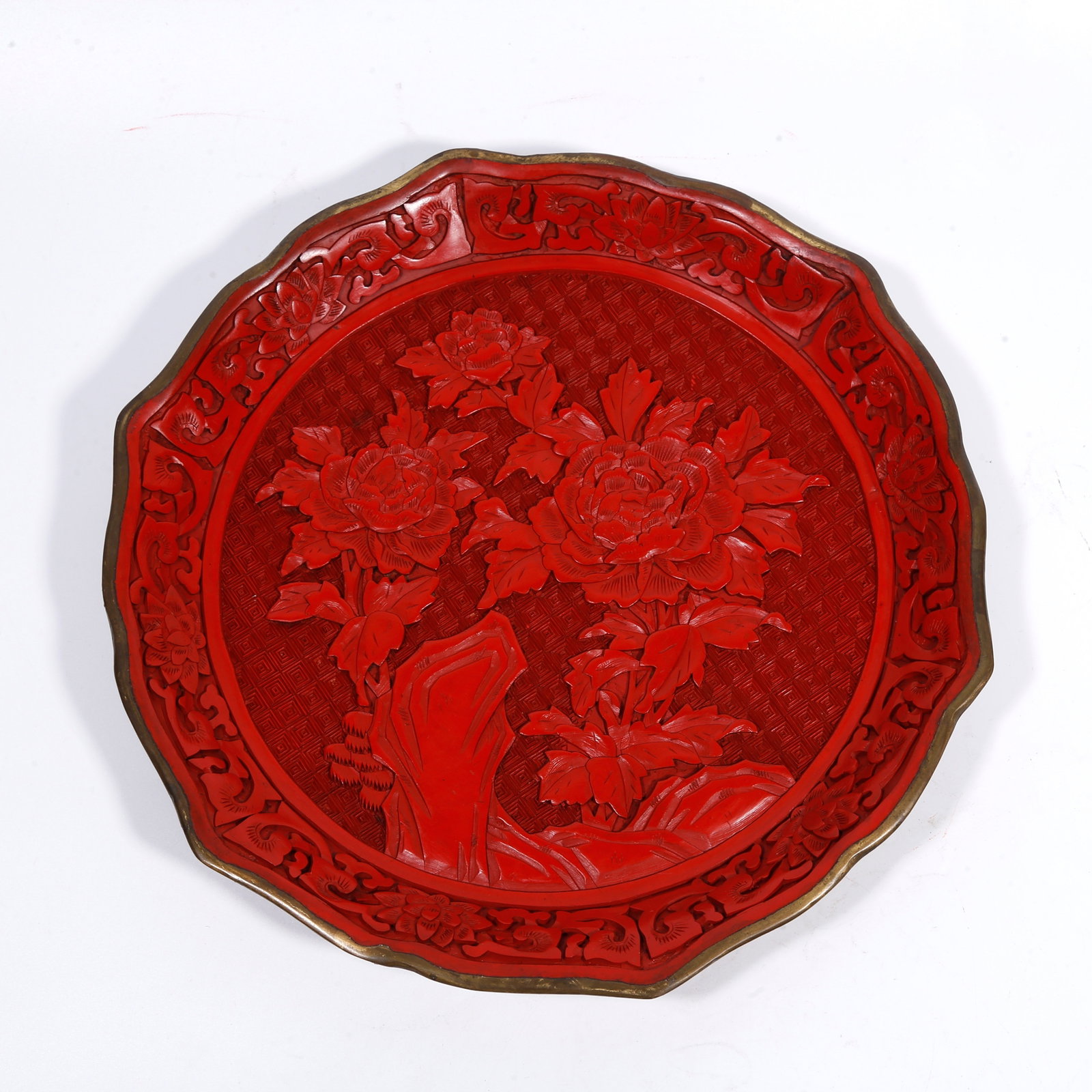 A CARVED-RED FLOWER-RIM PLATE WITH ROCK-AND-FLOWER PATTERN (1 of 8)