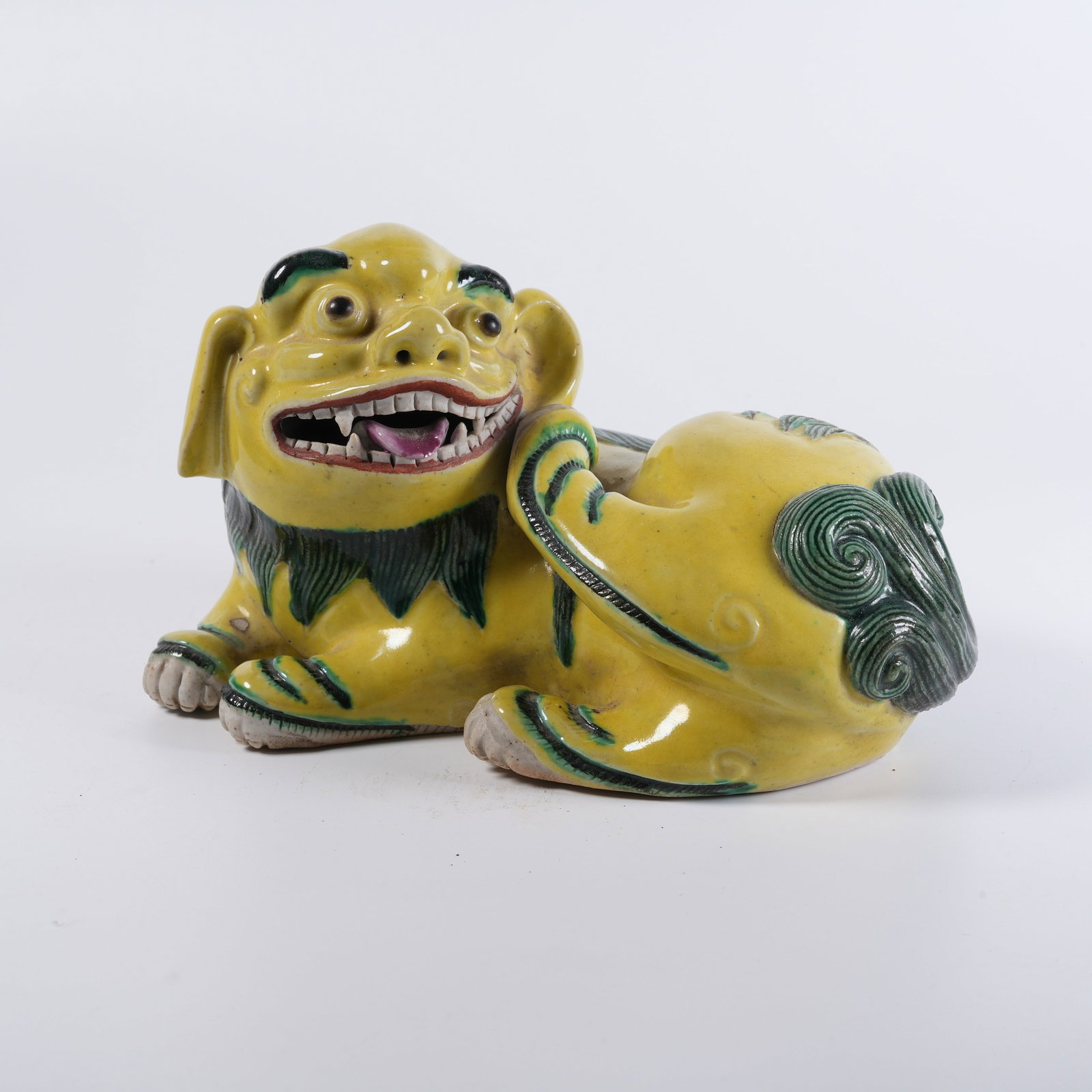 A YELLOW-GREEN ENAMEL MYTHICAL BEAST PAPERWEIGHT (1 of 8)