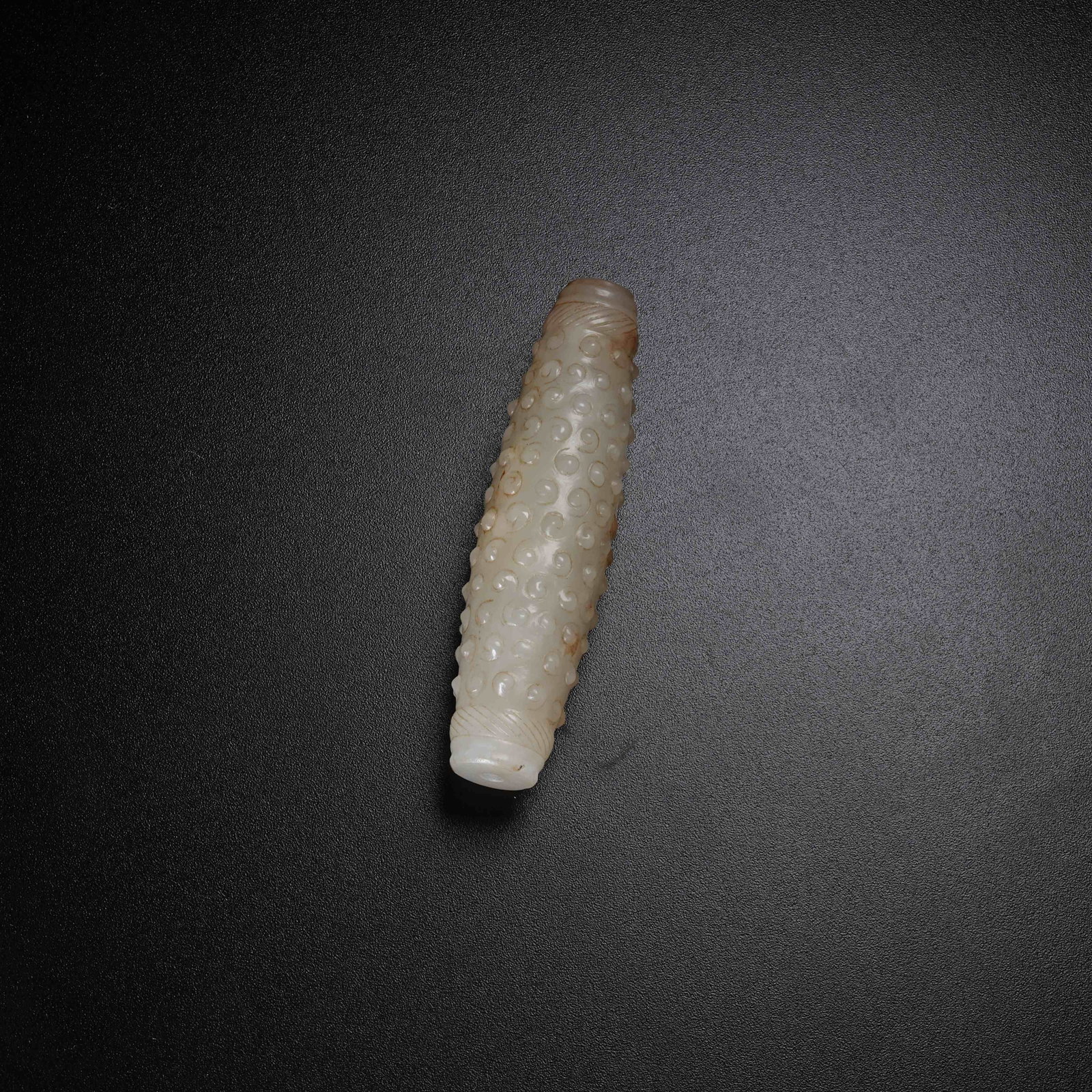 A ANCIENT JADE TUBE PENDANT WITH HOOKED CLOUD PATTERN (1 of 9)