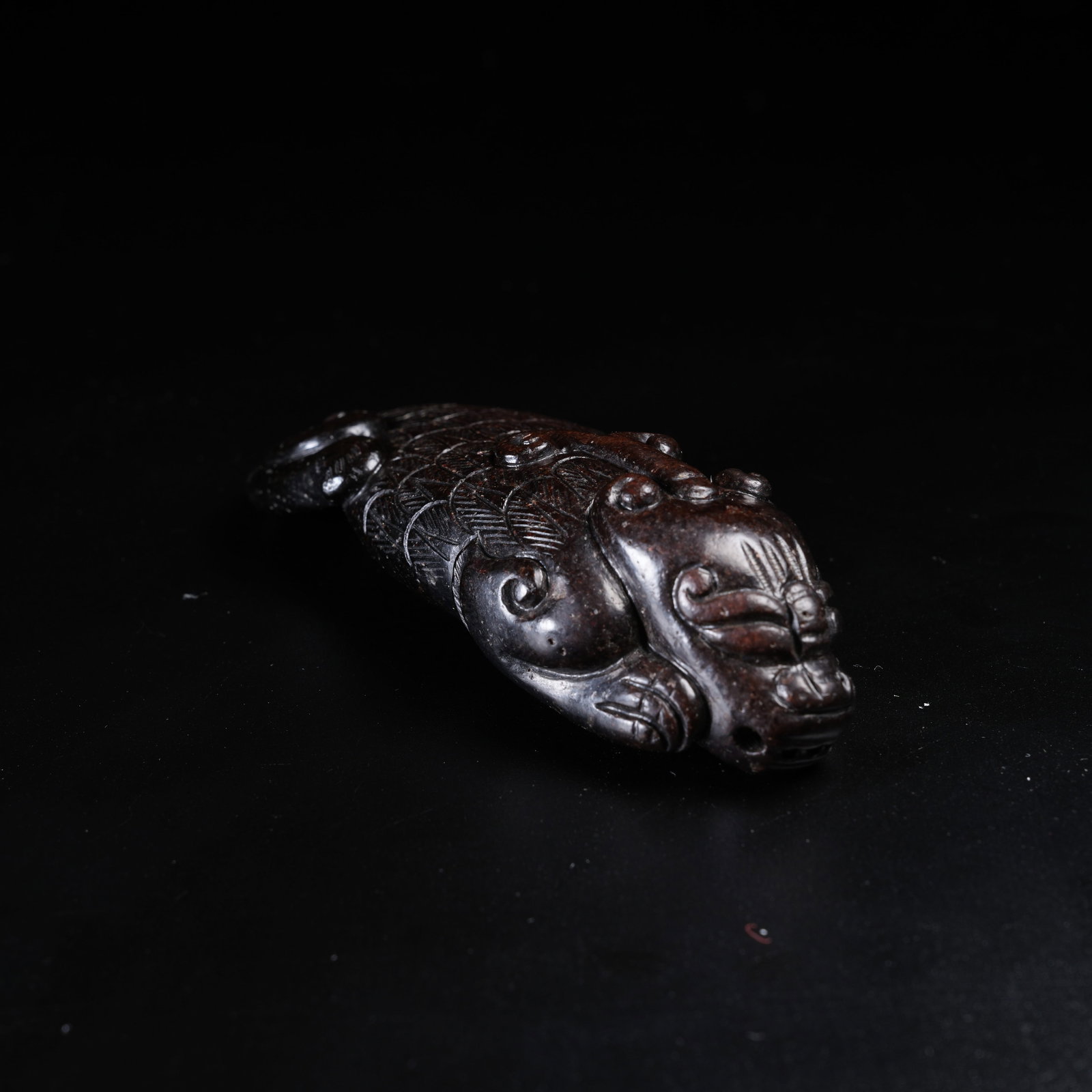 A ANCIENT JADE MAKARA PENDANT: Ancient Jade Makara Pendant