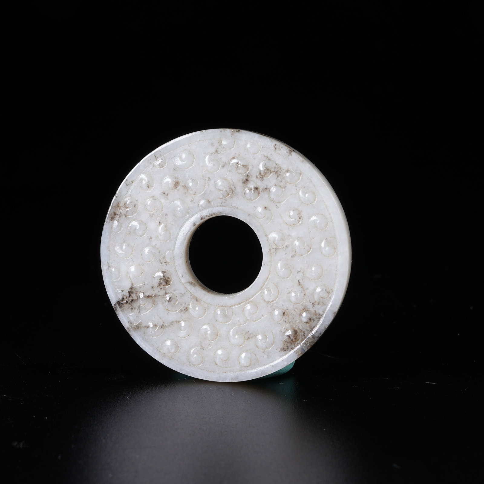 A HETIAN JADE BI DISC WITH SCROLLED CLOUD PATTERN (1 of 9)