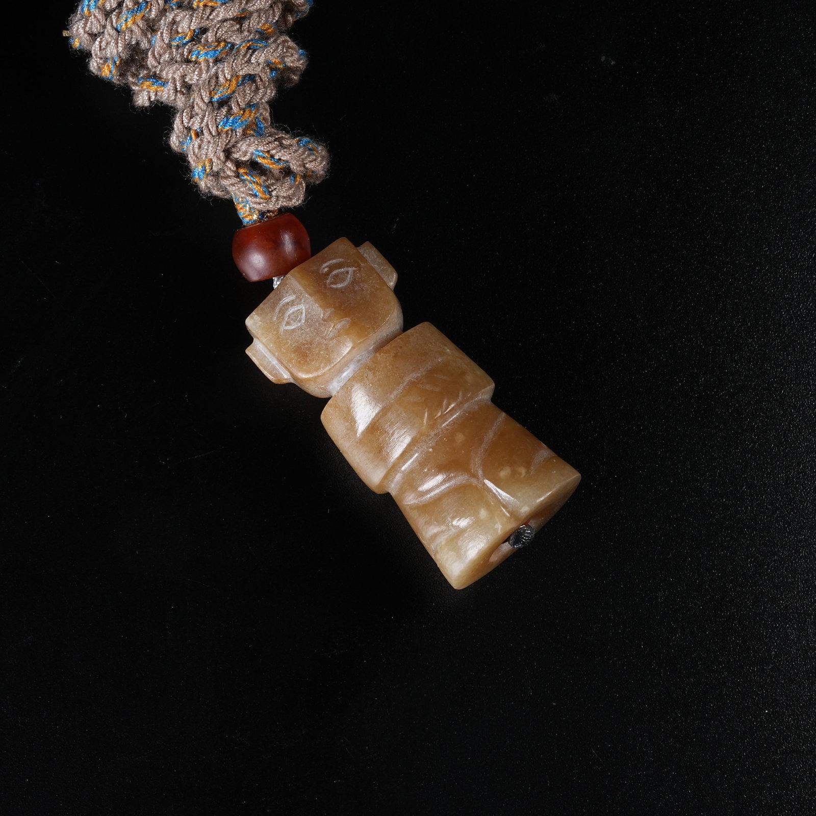 A HETIAN JADE KNEELING FIGURE PENDANT (1 of 8)