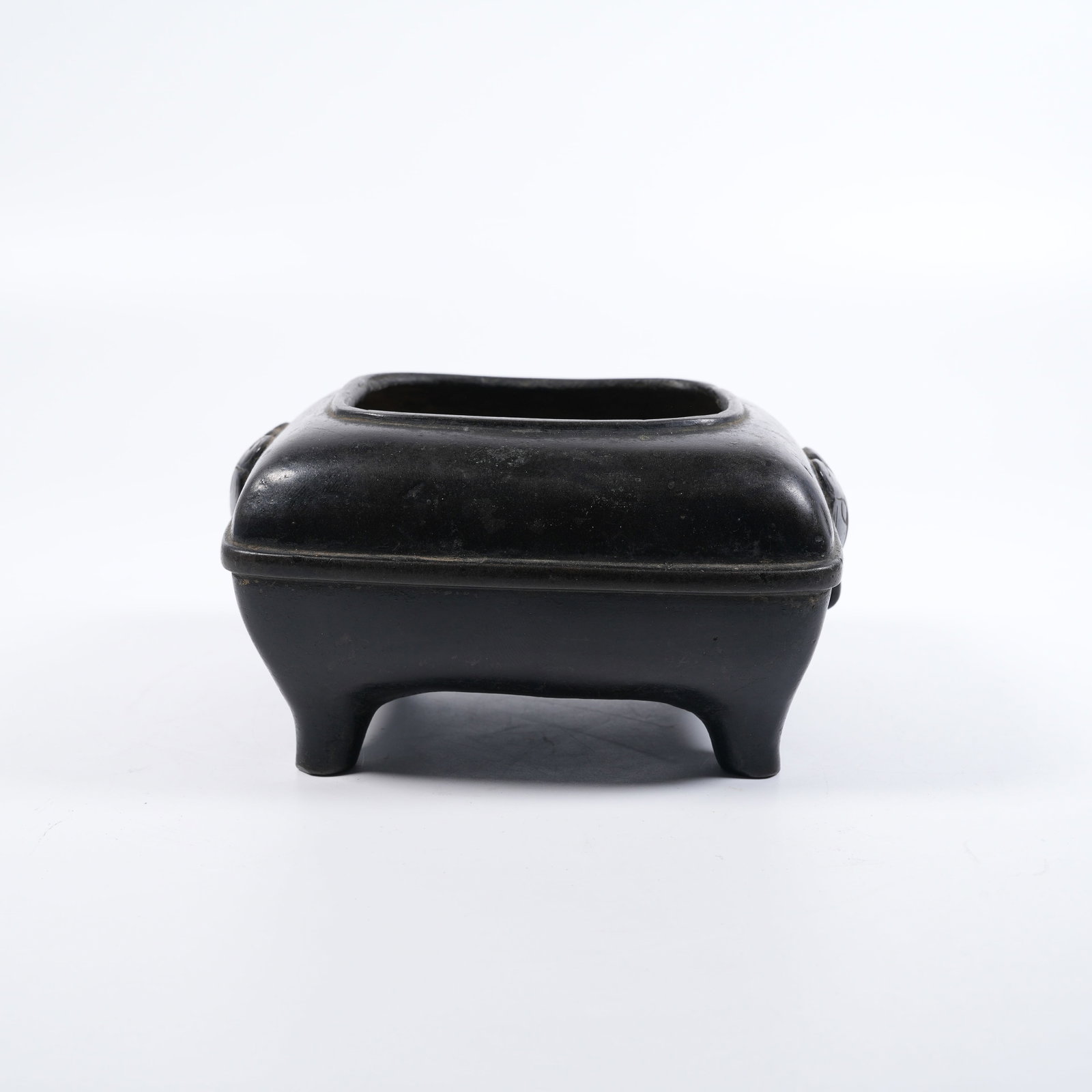 A SQUARE COPPER CENSER WITH BEAST-MASK KNOCKERS: Square copper censer with beast-mask knockers
