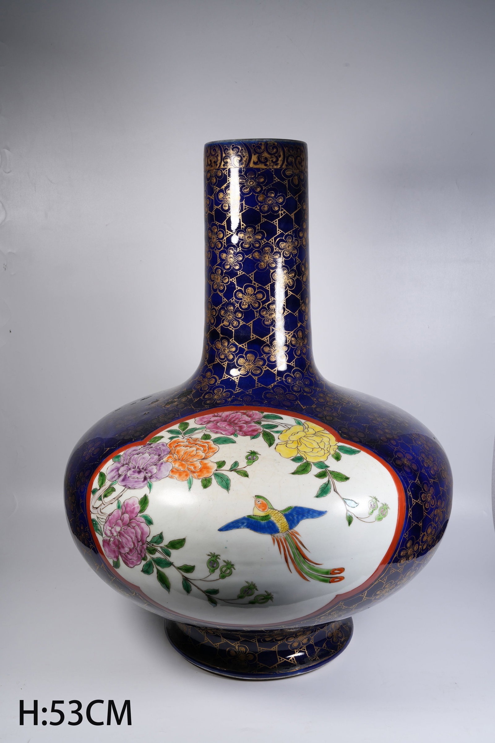 A LARGE BLUE-GROUND GILDED WATER-CHESTNUT-SHAPED VASE WITH RESERVED-PANEL FAMILLE-ROSE (1 of 9)
