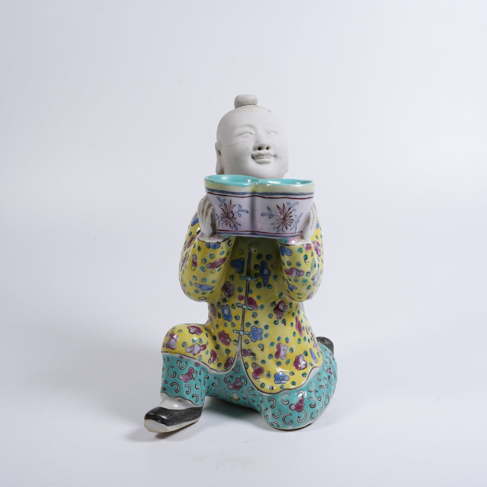 A FAMILLE-ROSE WATER POT WITH BOY-HOLDING-TREASURE MOTIF: Famille-rose water pot with boy-holding-treasure motif