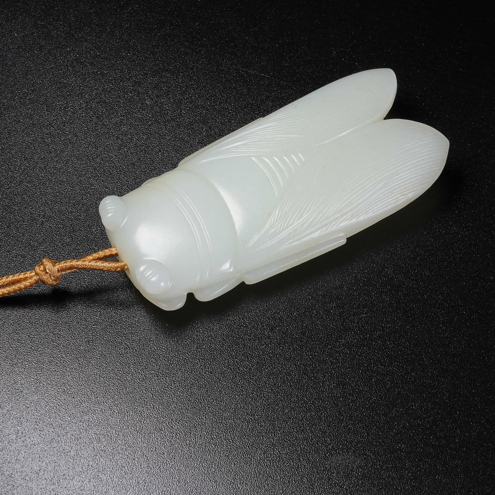 A WHITE HETIAN JADE CICADA: White Hetian Jade Cicada