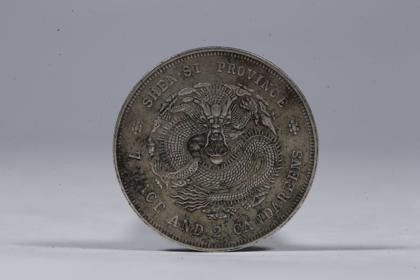 A SILVER DOLLAR COIN - 3