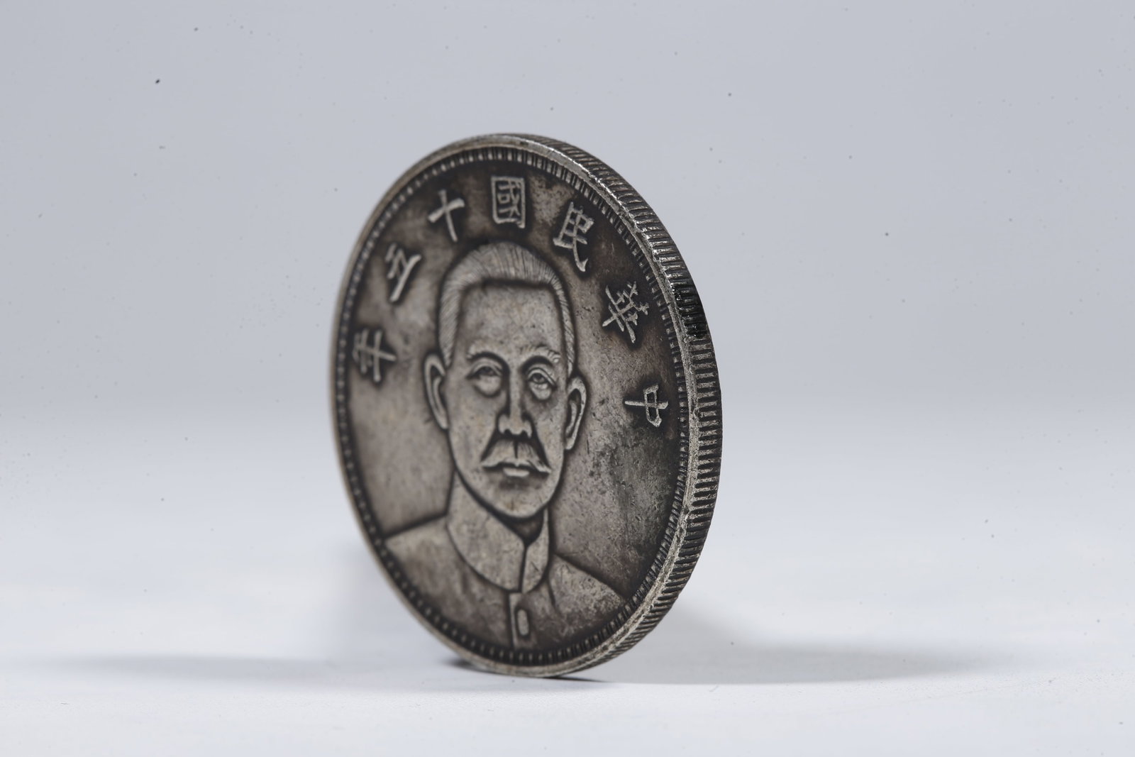 A SILVER DOLLAR COIN - 2