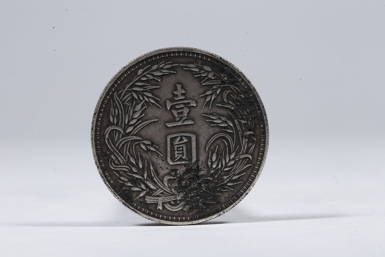 A SILVER DOLLAR COIN - 3