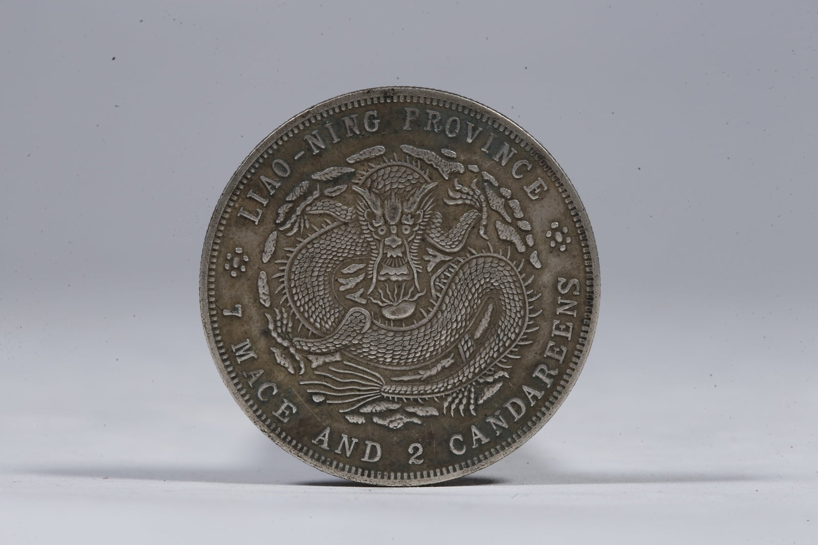 A SILVER DOLLAR COIN - 3